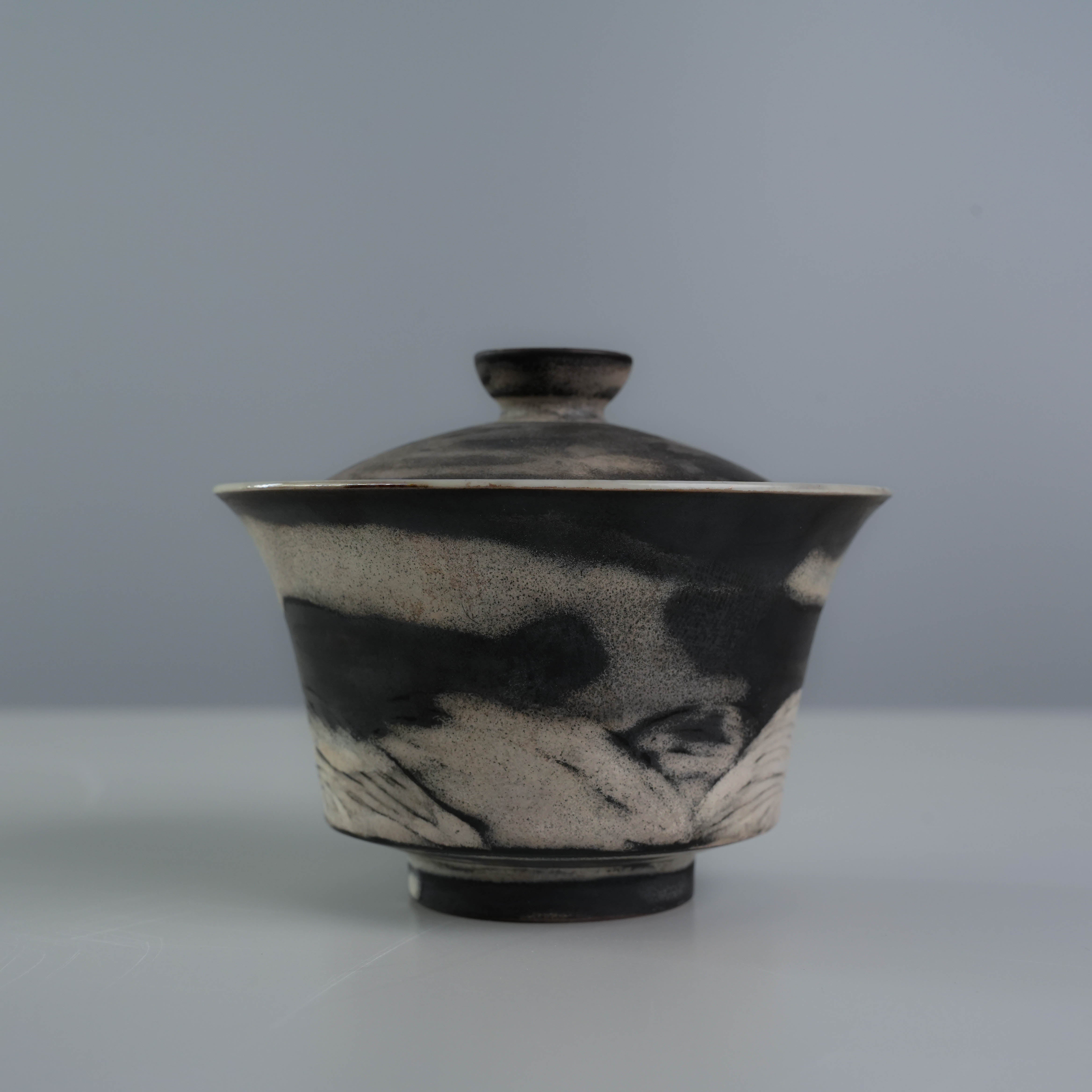 Back view of the Lonesome Studio Qushui gaiwan, showcasing hand-painted mountain landscape in black and silver glaze for Gongfu Cha.