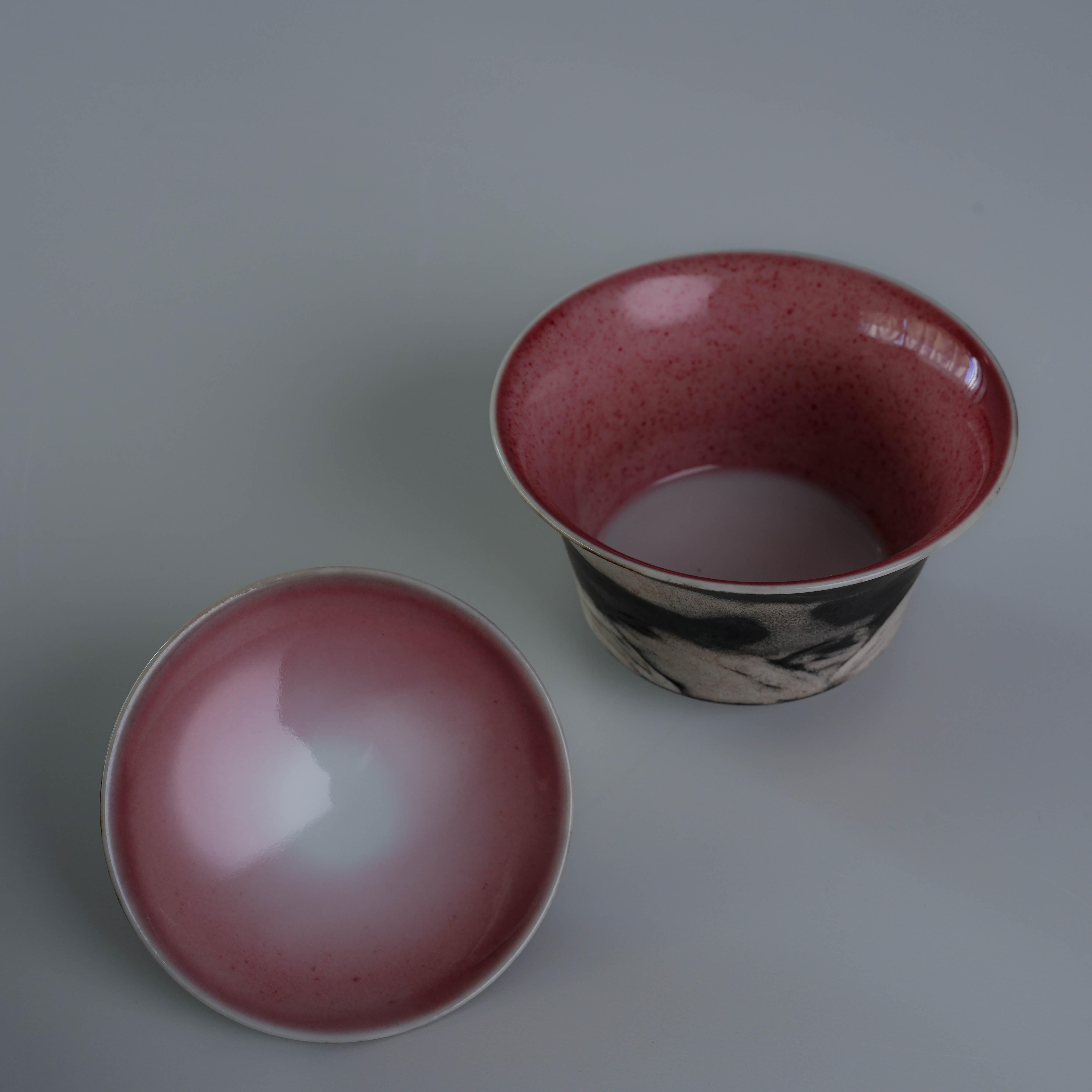 Interior and exterior of Lonesome Studio Qushui tea cup, featuring red glaze inside and moonlit mountain design outside, handmade for Gongfu Cha.