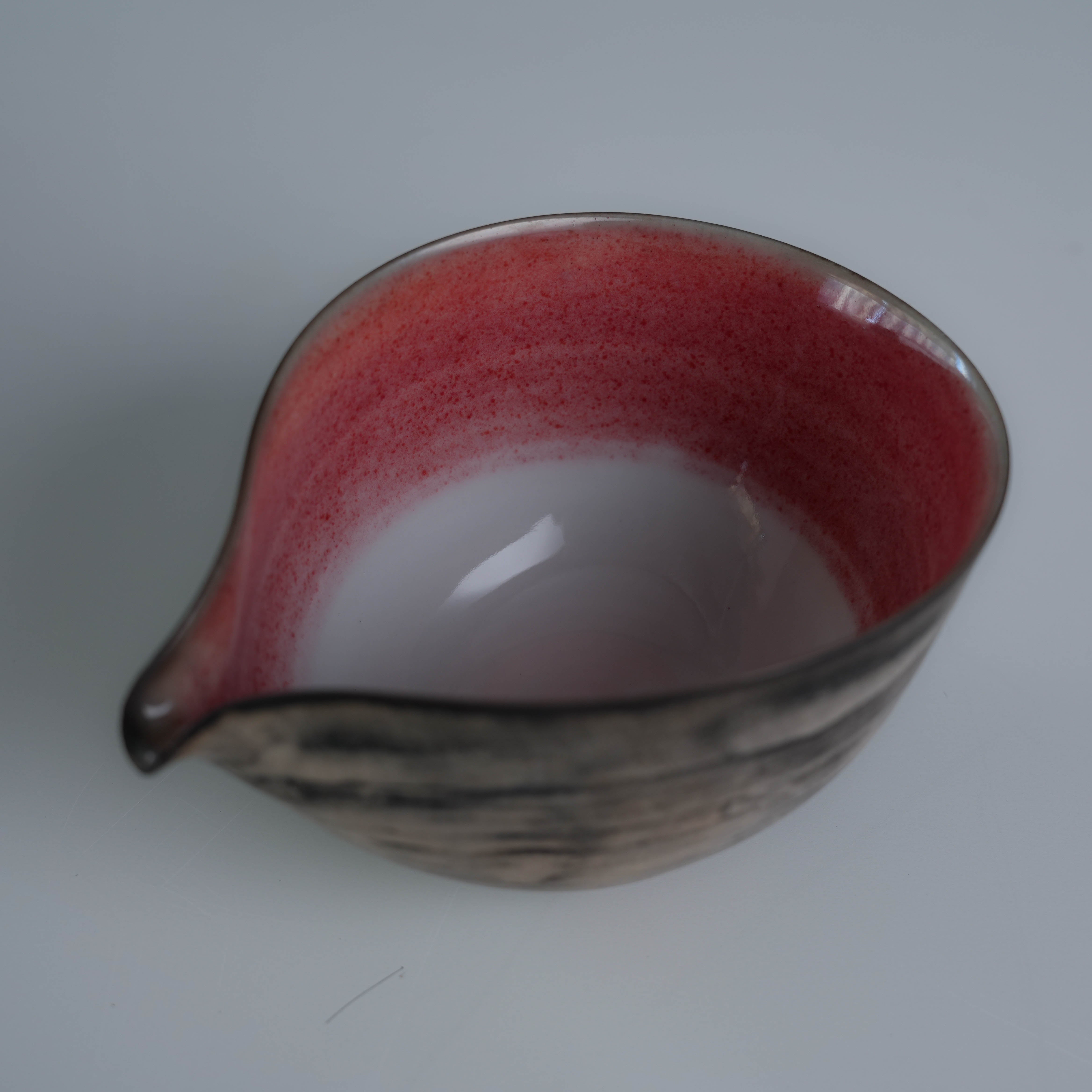 Interior detail of Lonesome Studio Qushui tea pitcher with red gradient glaze, handmade for Gongfu Cha tea set with silver glaze finish.