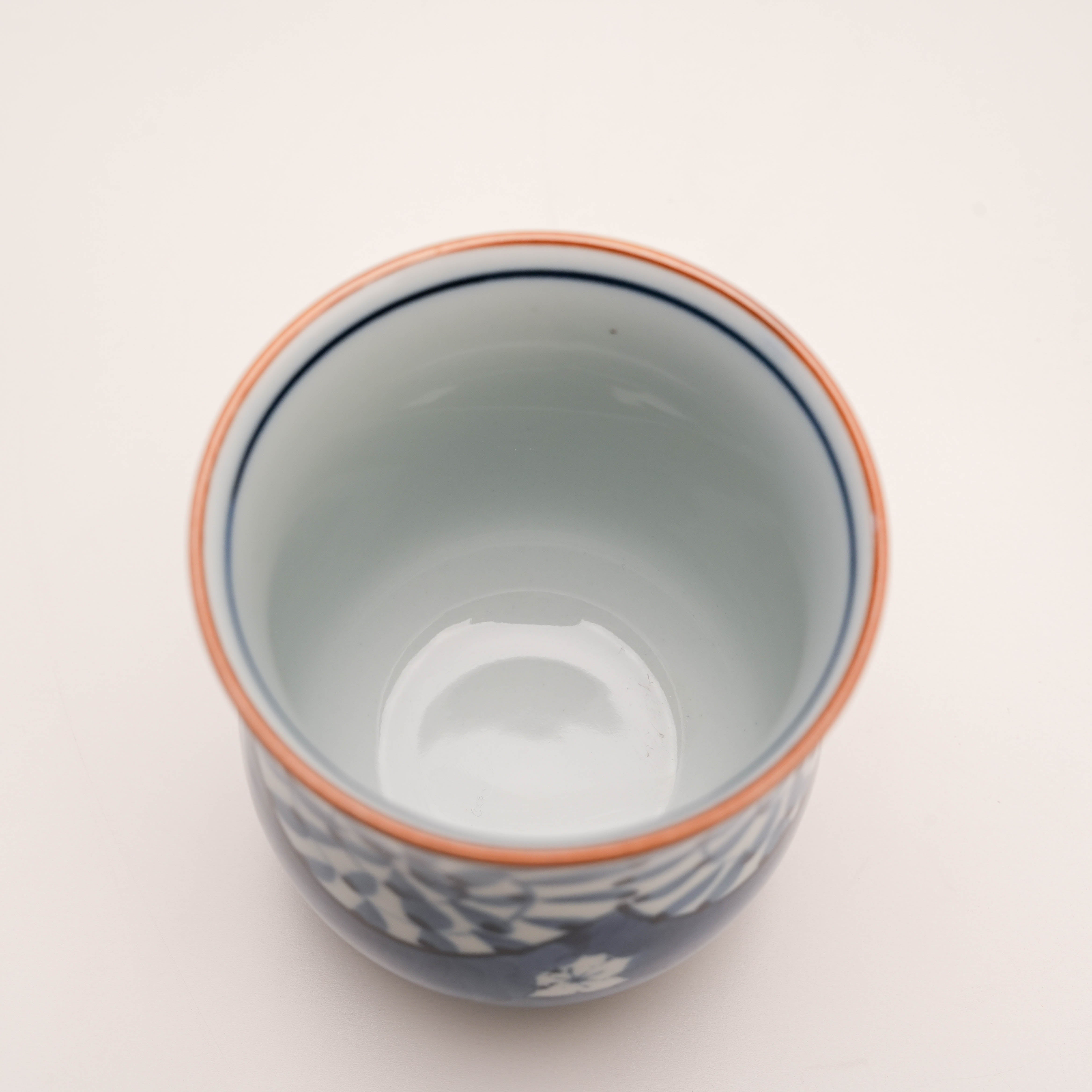 Interior view of blue Arita Ware Yunomi tea cup with smooth glazed finish. Enhances tea aroma and traditional drinking experience.