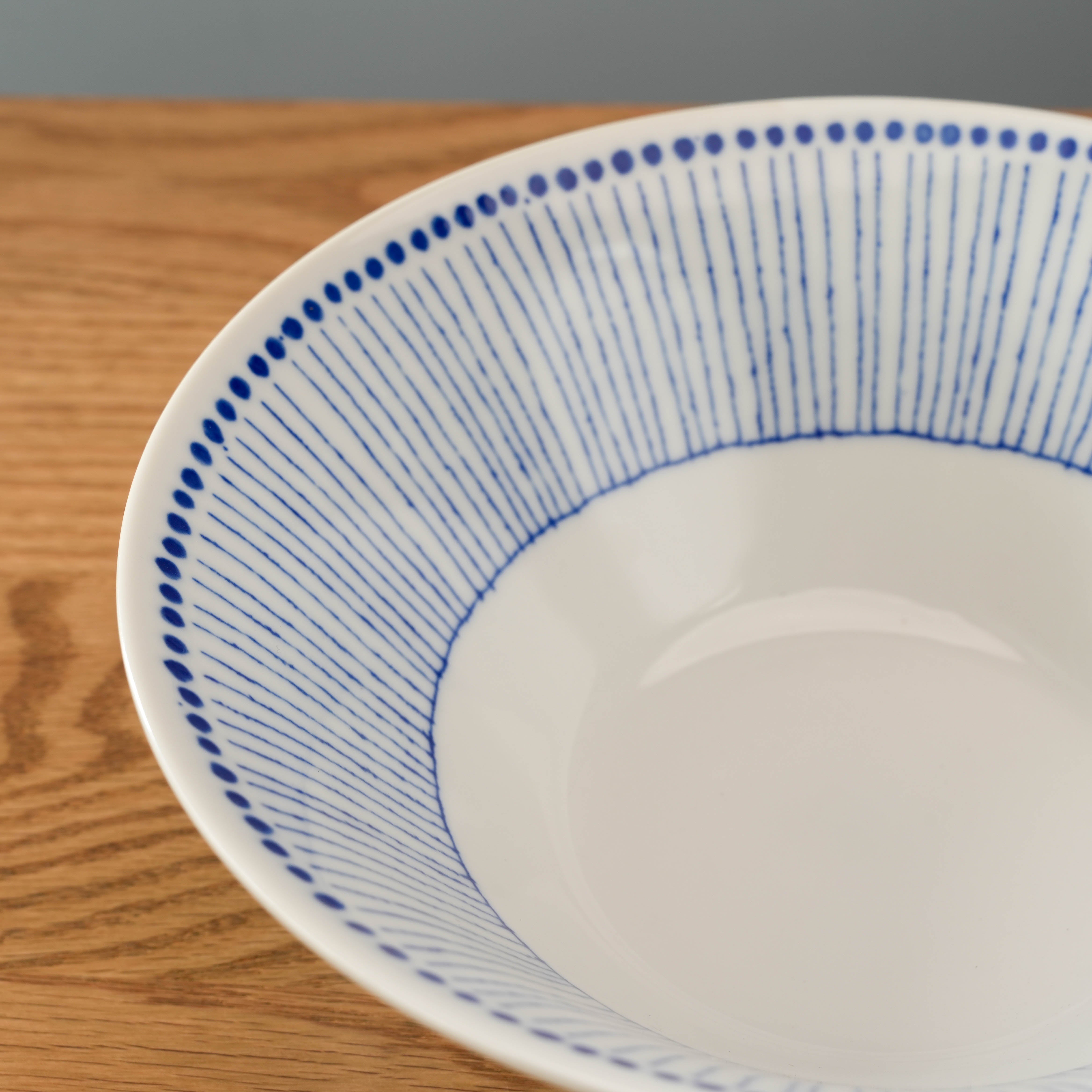 Interior view of Mino Ware Blue Tokusa Dot Bowl showing fine blue stripes and dotted rim, perfect for stylish noodle presentation.
