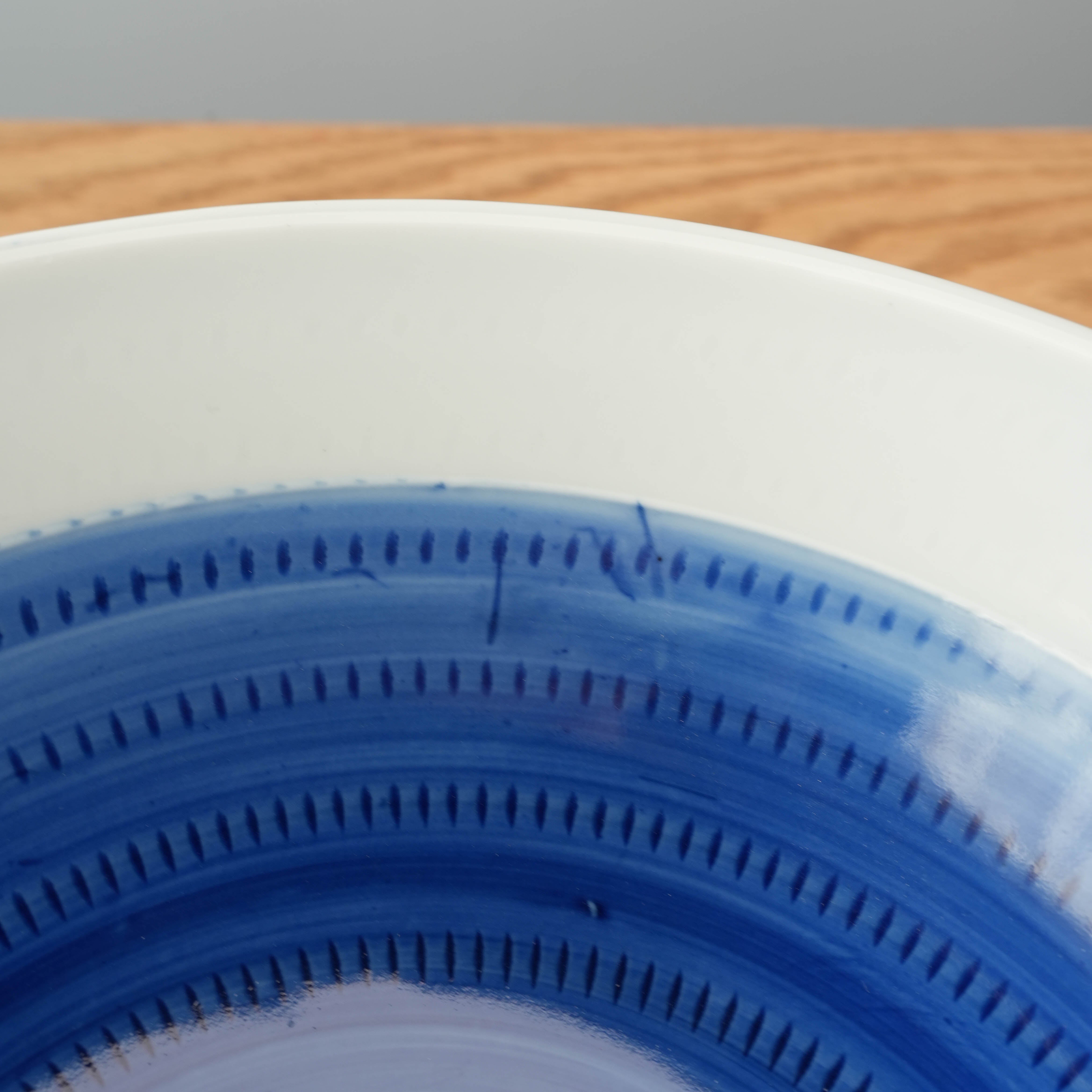Close-up of Mino Ware Tochiri Donburi Bowl showing intricate blue brush pattern detailing, highlighting traditional Japanese craftsmanship.