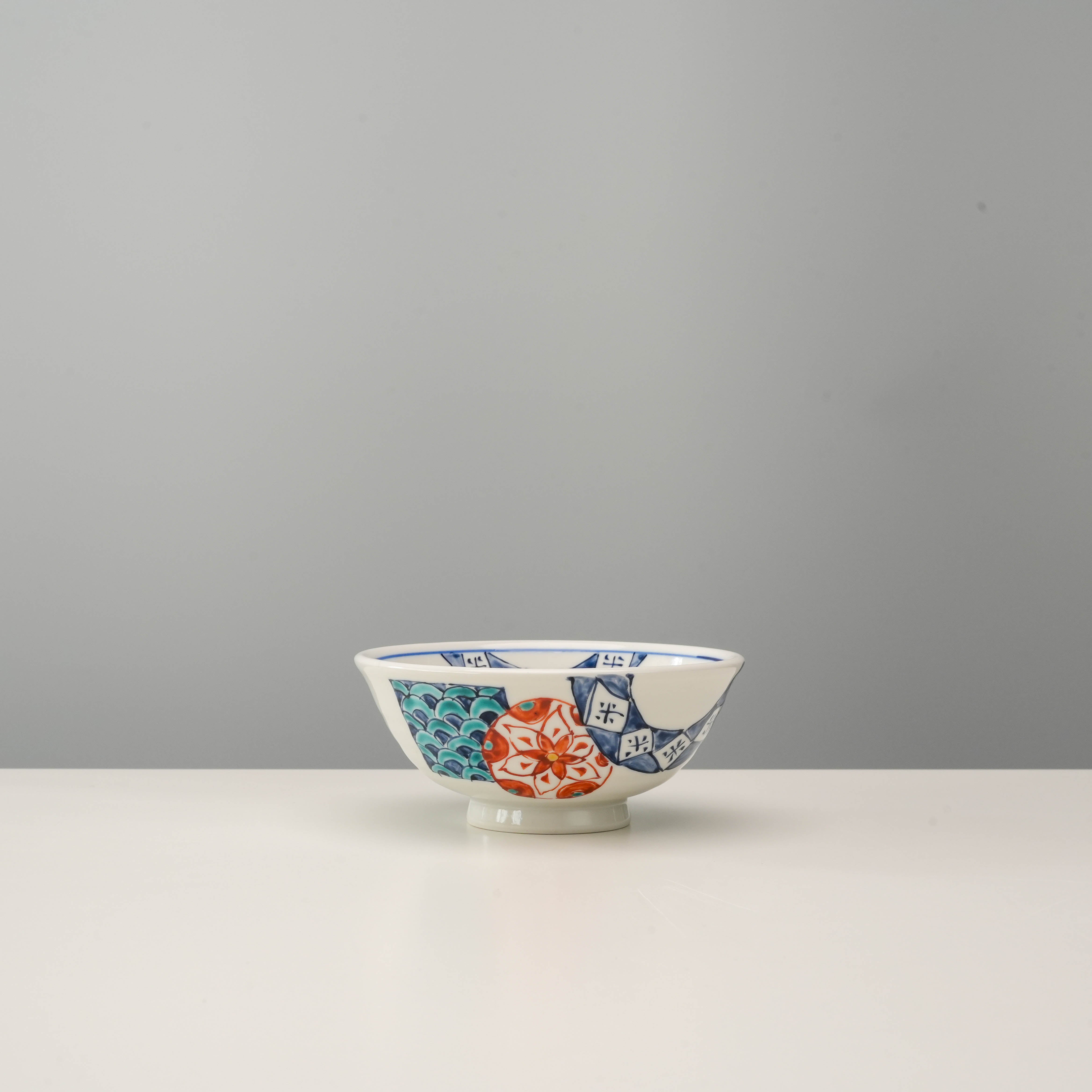 Kutani Rice Bowl - Hanamaru Pattern features traditional Aka-Gosu colors with bird and chrysanthemum motifs, ideal for elegant table settings.
