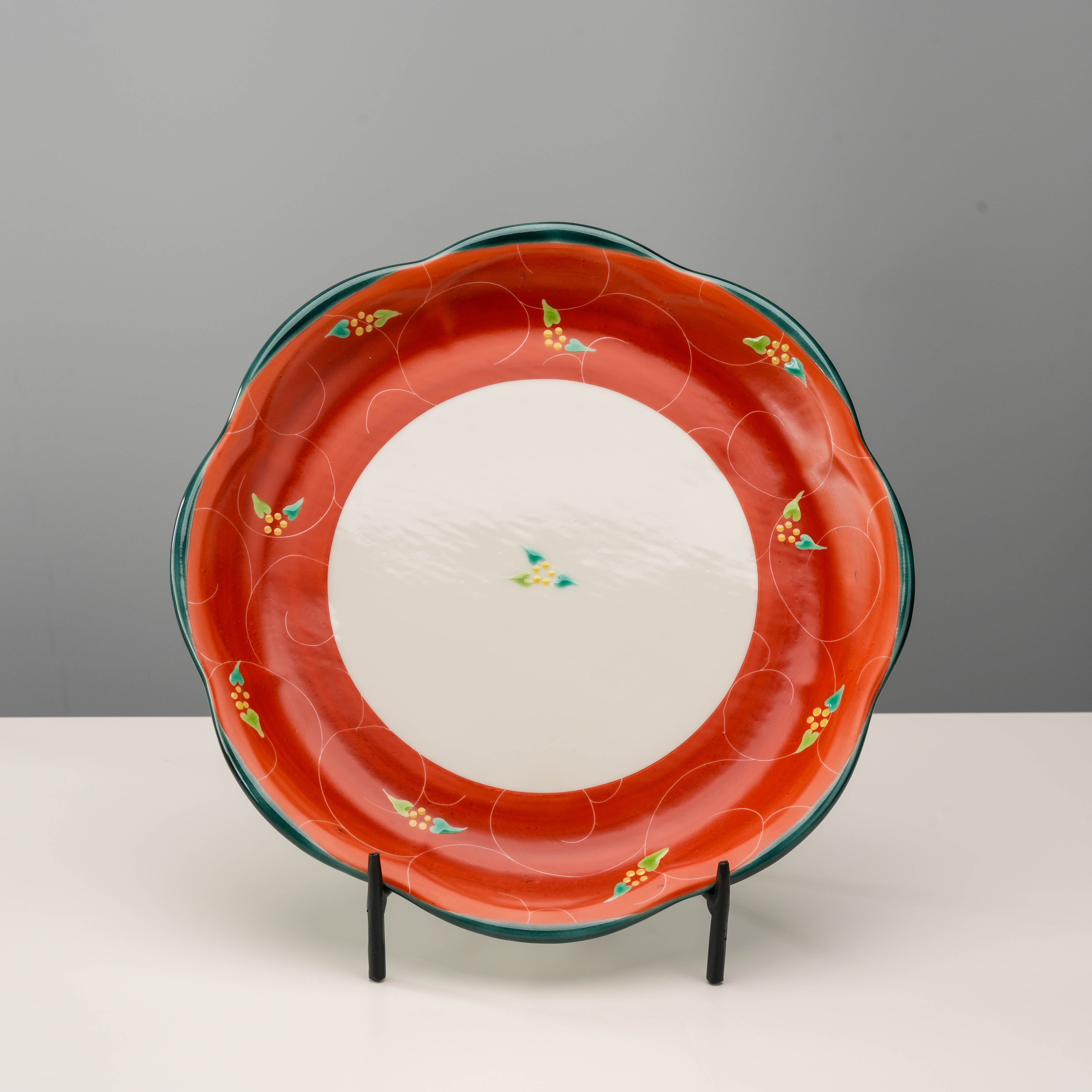 Kutani Ware Plate - Vermilion Arabesque with scalloped rim and floral motifs, ideal for elegant dining or decorative display.