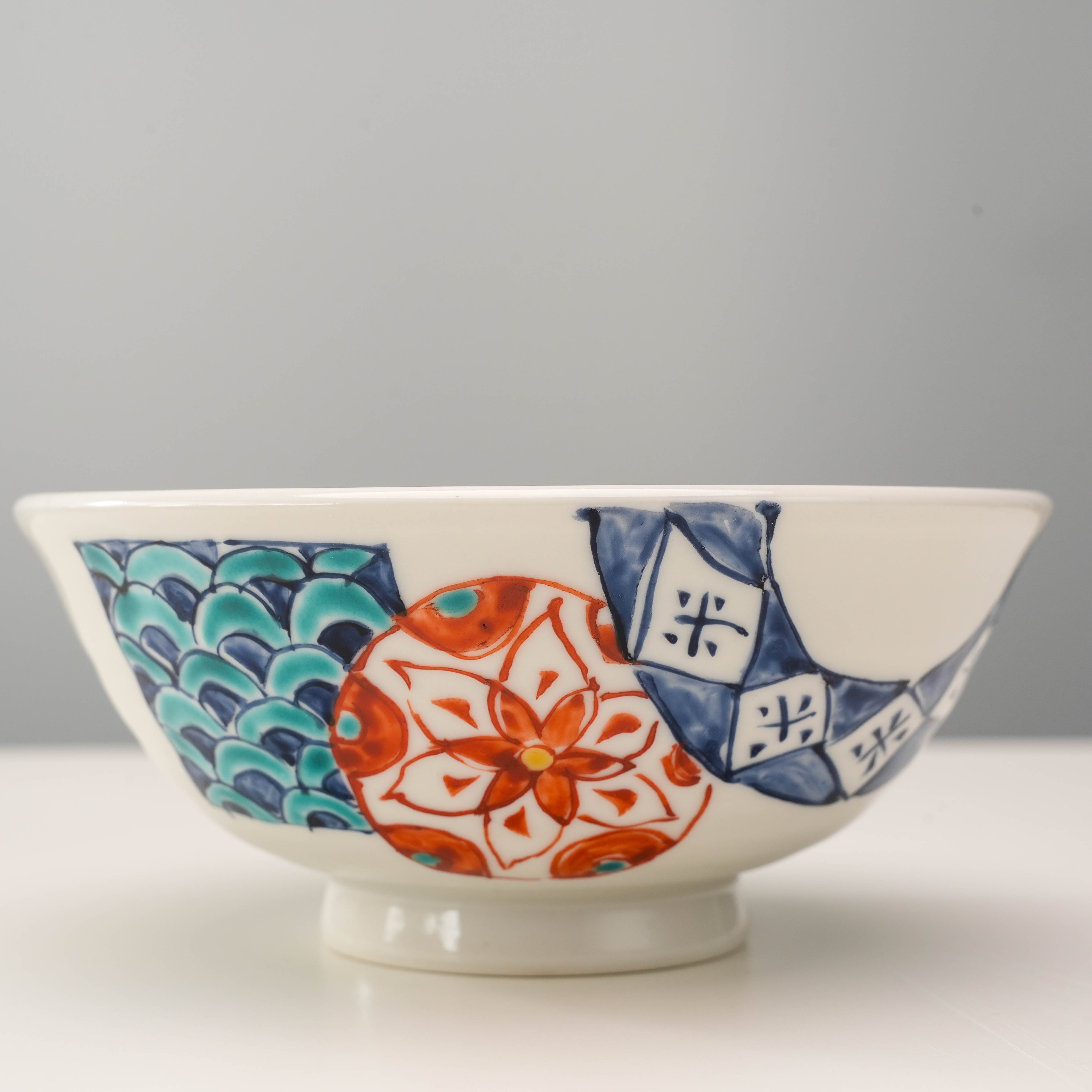 Close-up of Kutani Ware Rice Bowl showcasing intricate Hanamaru floral design and geometric patterns, perfect for Japanese-style dining decor.