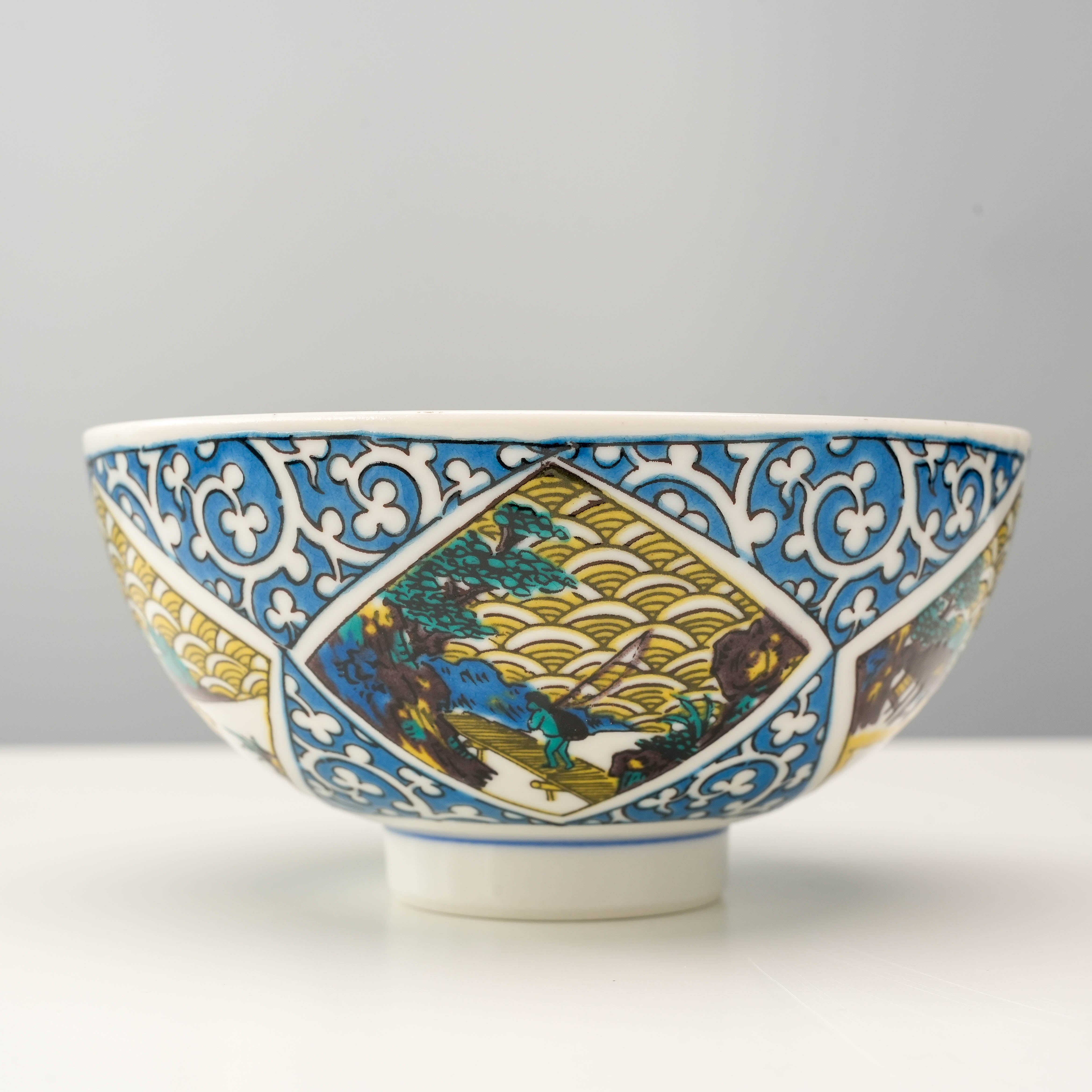 Close-up of Kutani Ware Rice Bowl with detailed arabesque and landscape design, showcasing traditional Japanese craftsmanship for elegant dining.