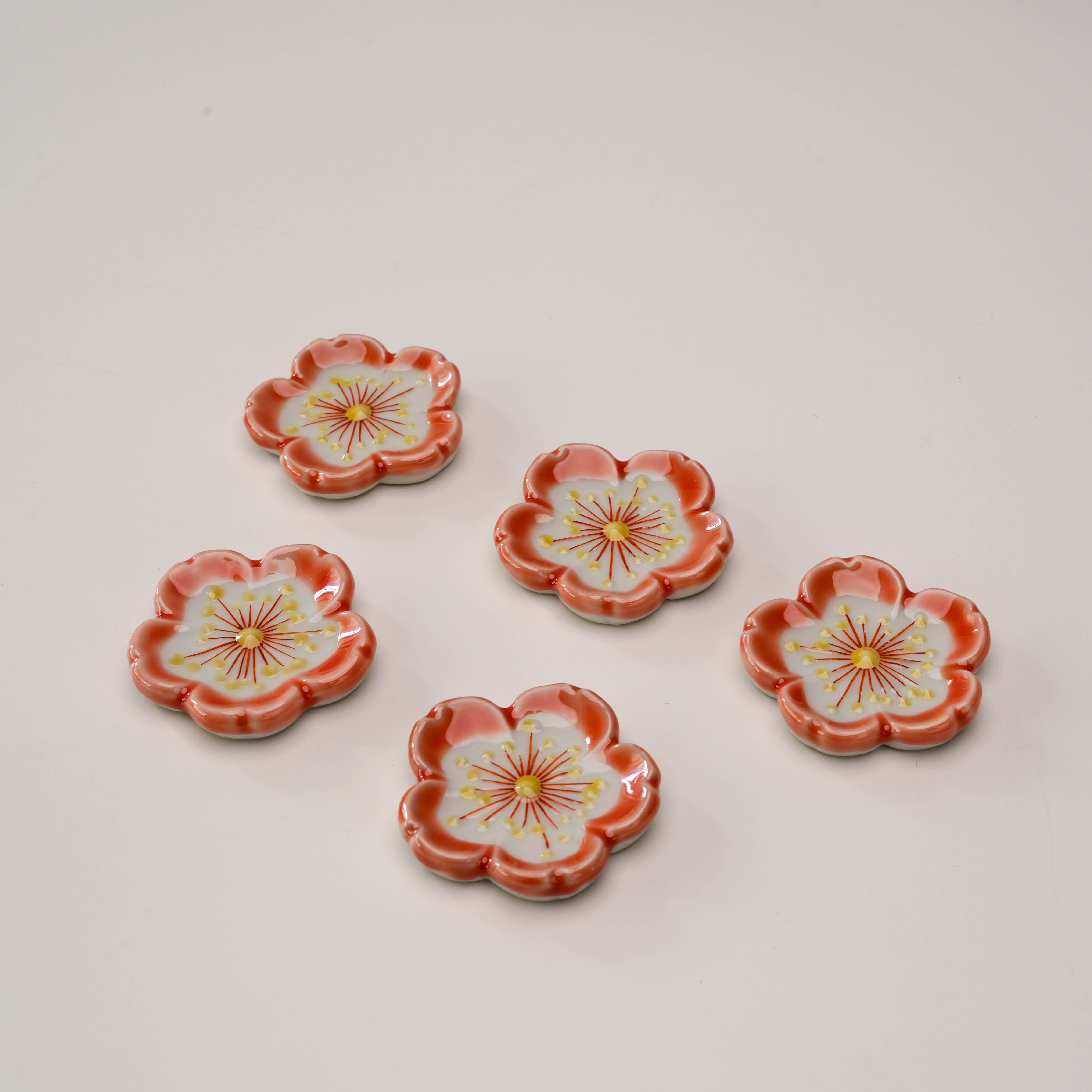 Kutani Ware Sakura - Chopstick Rest | 5-Piece Set featuring hand-painted cherry blossom design in red and white, ideal for elegant table settings.