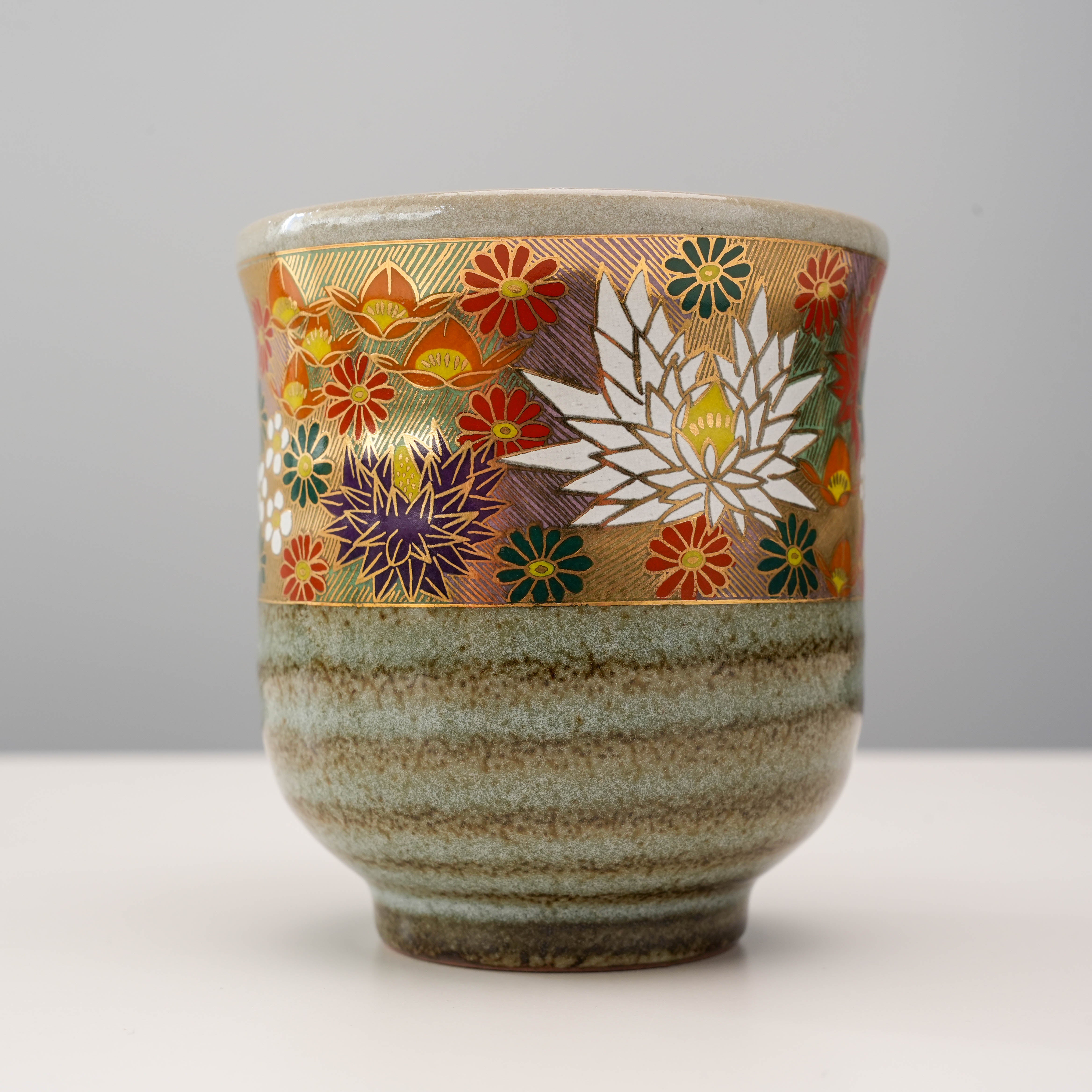 Close-up of Golden Garden Yunomi Teacup showcasing detailed gold leaf chrysanthemums and traditional Kutani craftsmanship.