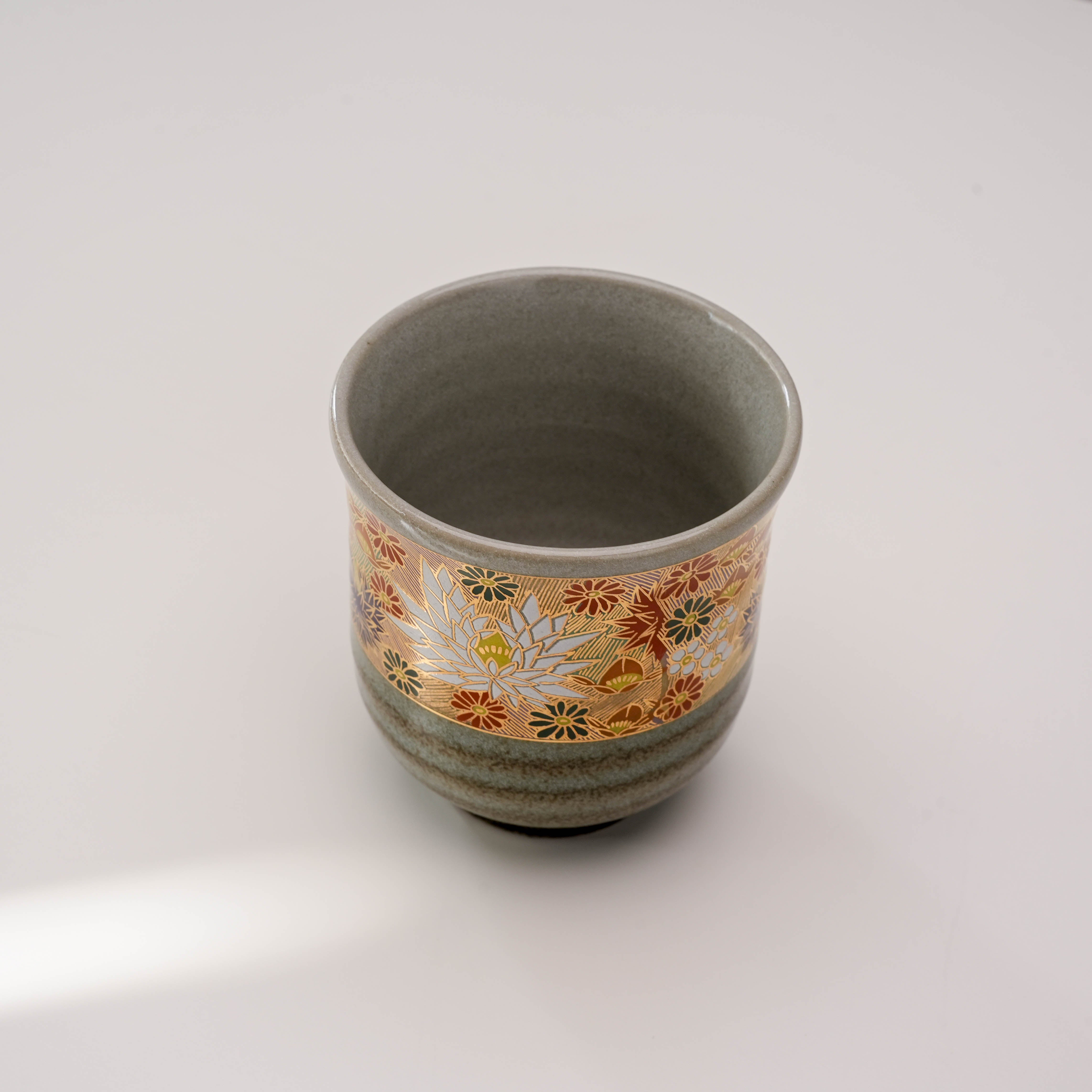 Top view of Kutani Ware Golden Garden Yunomi Teacup revealing smooth interior and vibrant floral motifs around the rim.