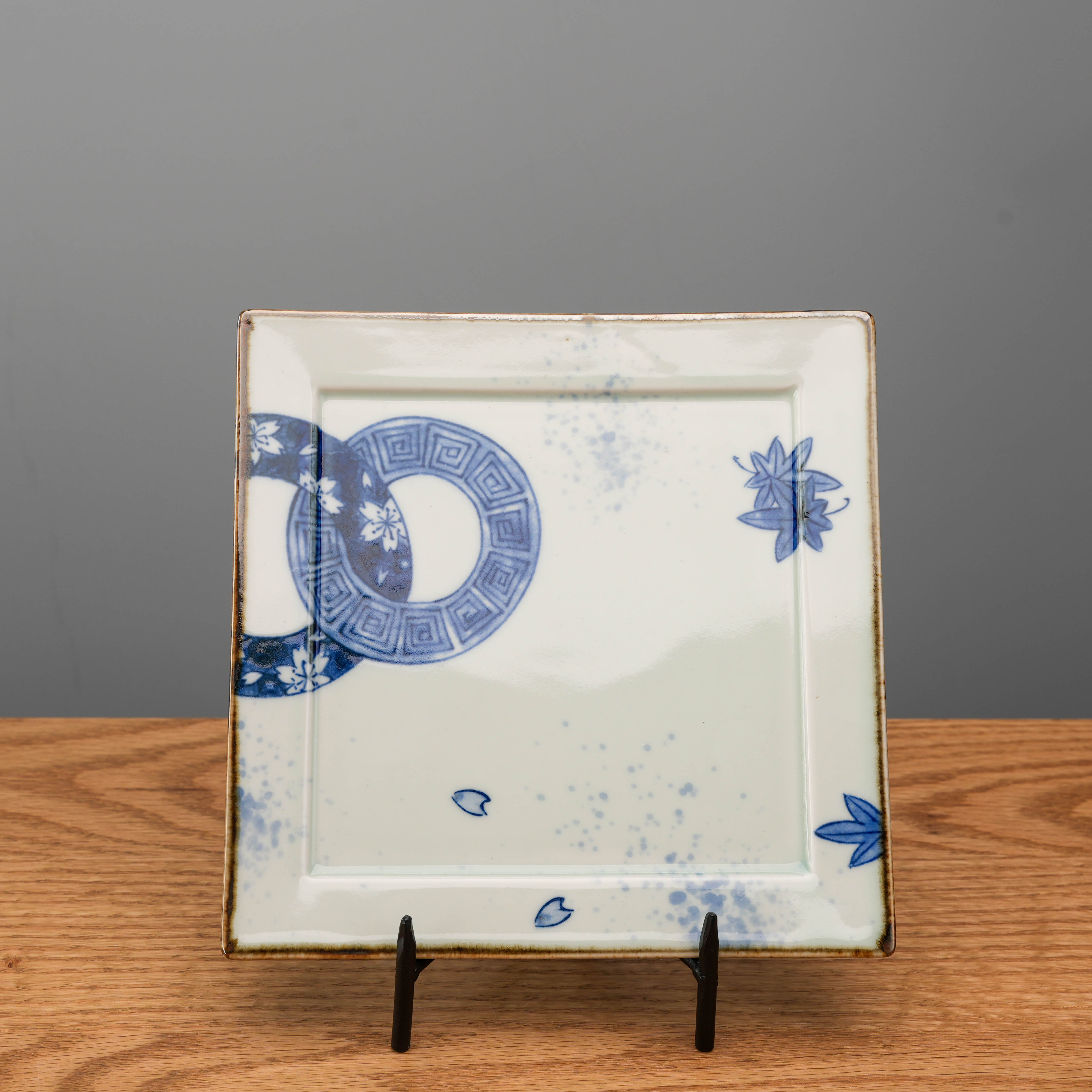 Seasonal Crest Square Plate in blue and white Mino Ware with hand-painted indigo motifs, ideal for serving appetizers or side dishes.