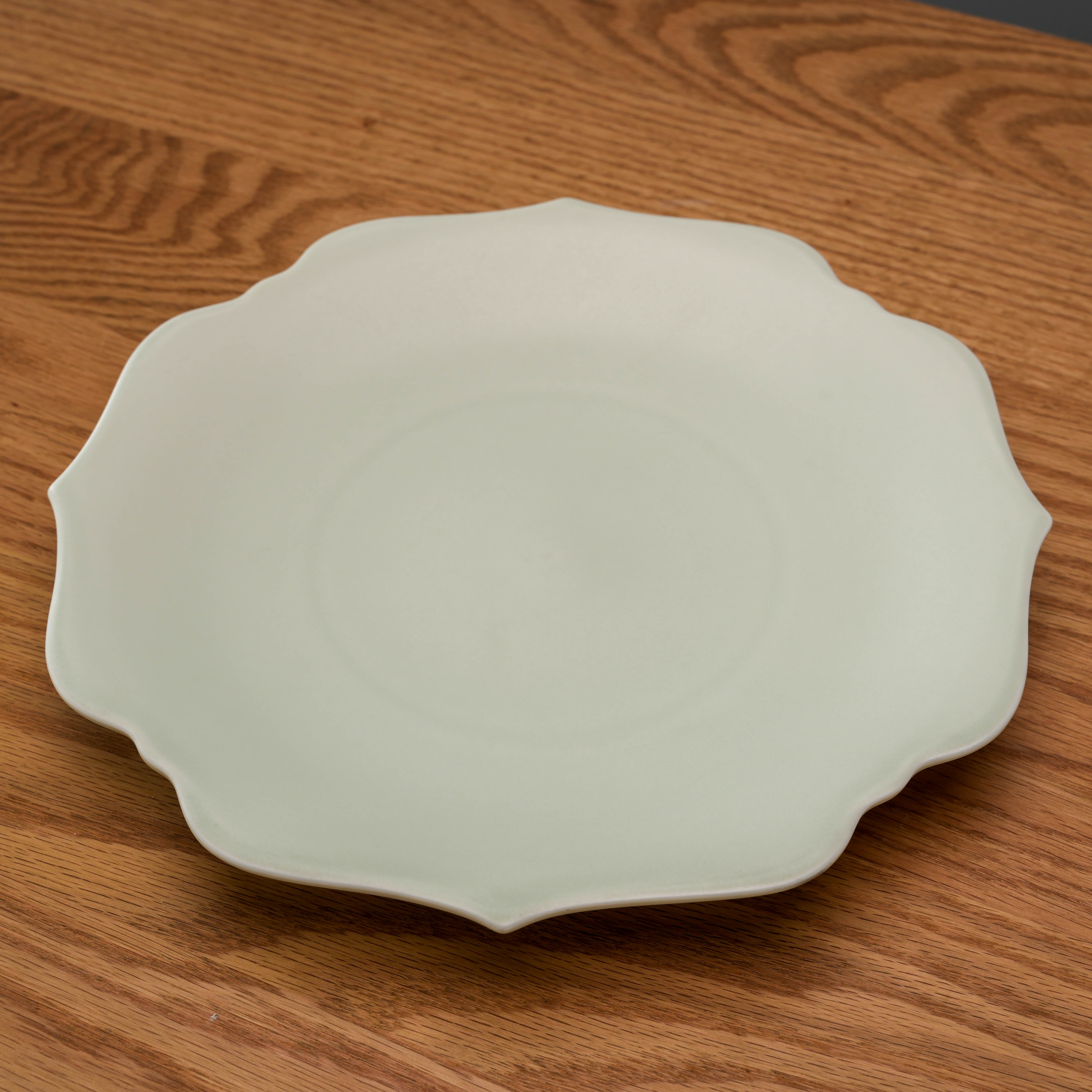 Top angled view of Mino Ware Meimei Plate - Light Cyan showcasing its delicate flower-like scalloped design and smooth ceramic finish.