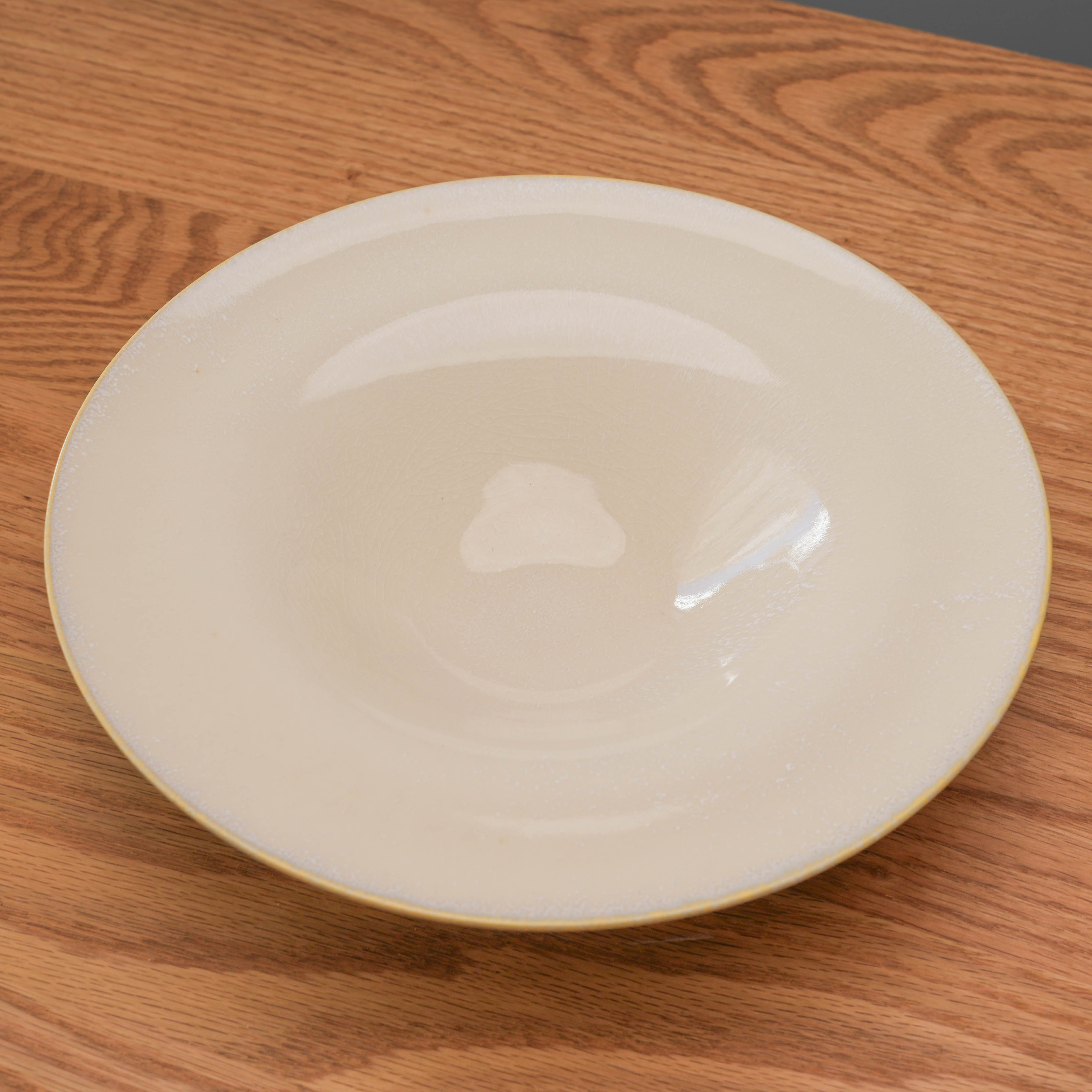 Mino Ware Glass Hat Bowl 24cm with a wide rim and deep center, ideal for serving pasta or salad, shown on a wooden table.