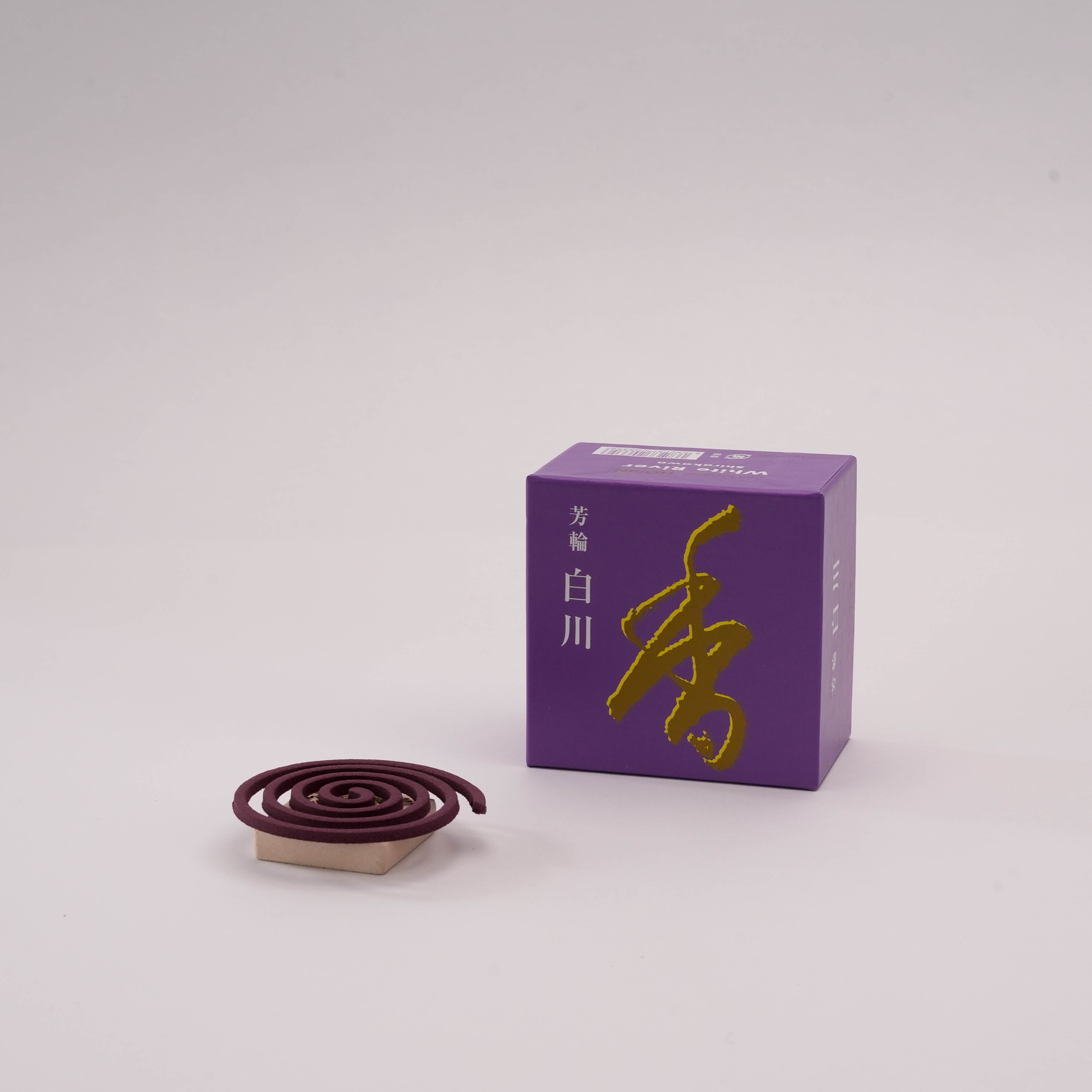 Shoyeido Horin White River incense coil with elegant purple box, offering a sweet sandalwood scent for tranquil home environments.