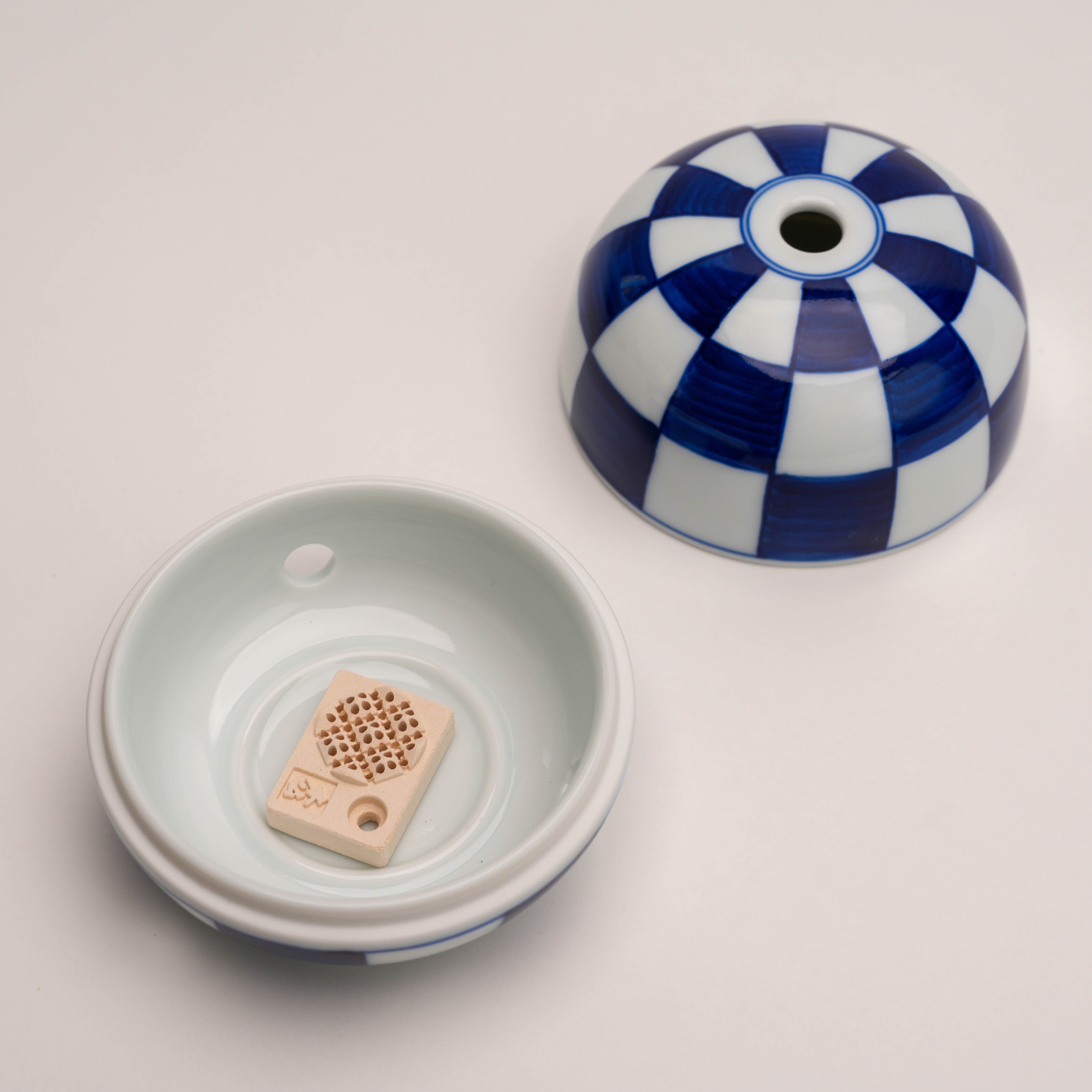 Open Shoyeido Miyuki Stone Incense Burner showing ceramic interior and incense holder, perfect for sticks, cones, or coils.
