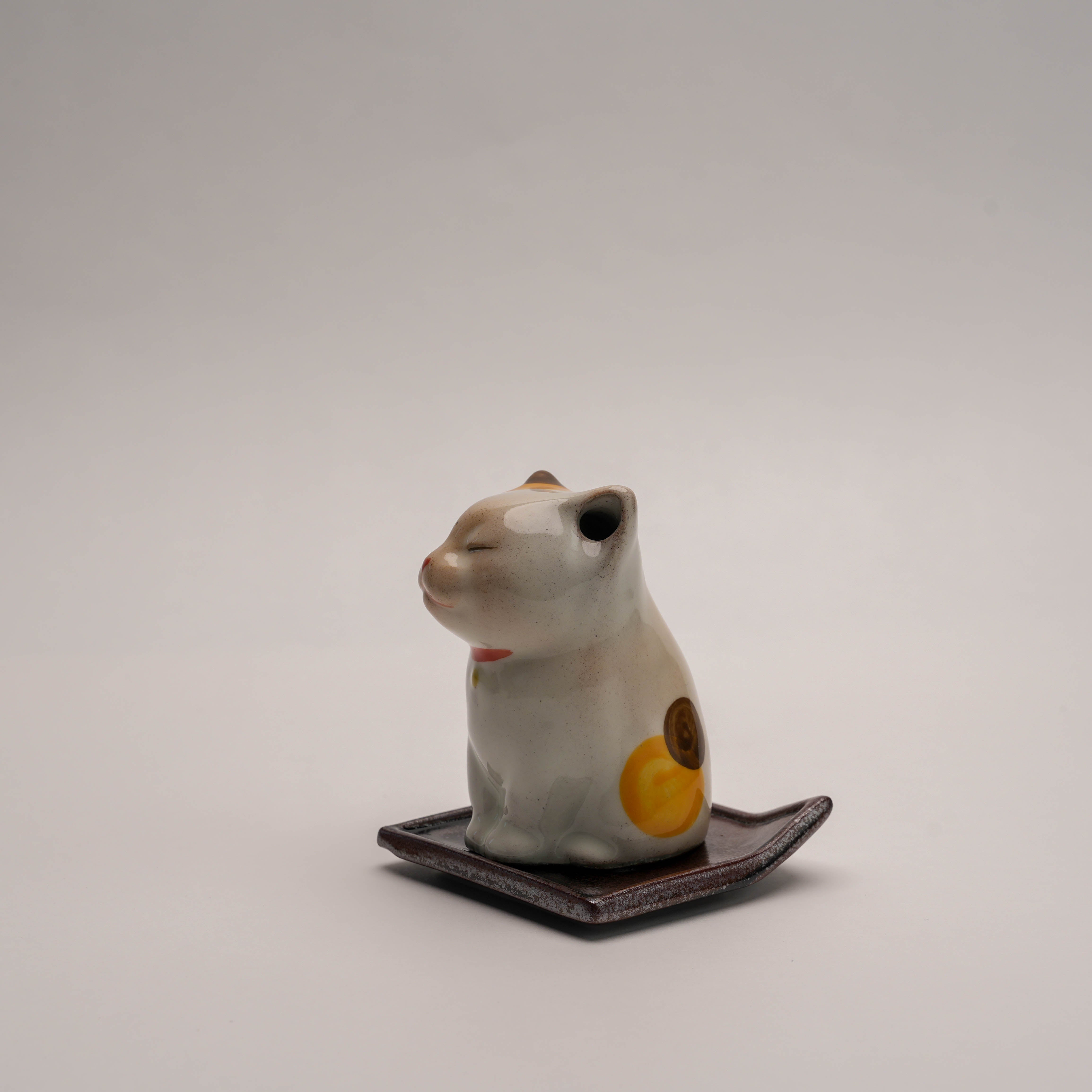 Side view of Shoyeido Cat Incense Burner showing calico pattern and ceramic craftsmanship, perfect for stylish incense burning.