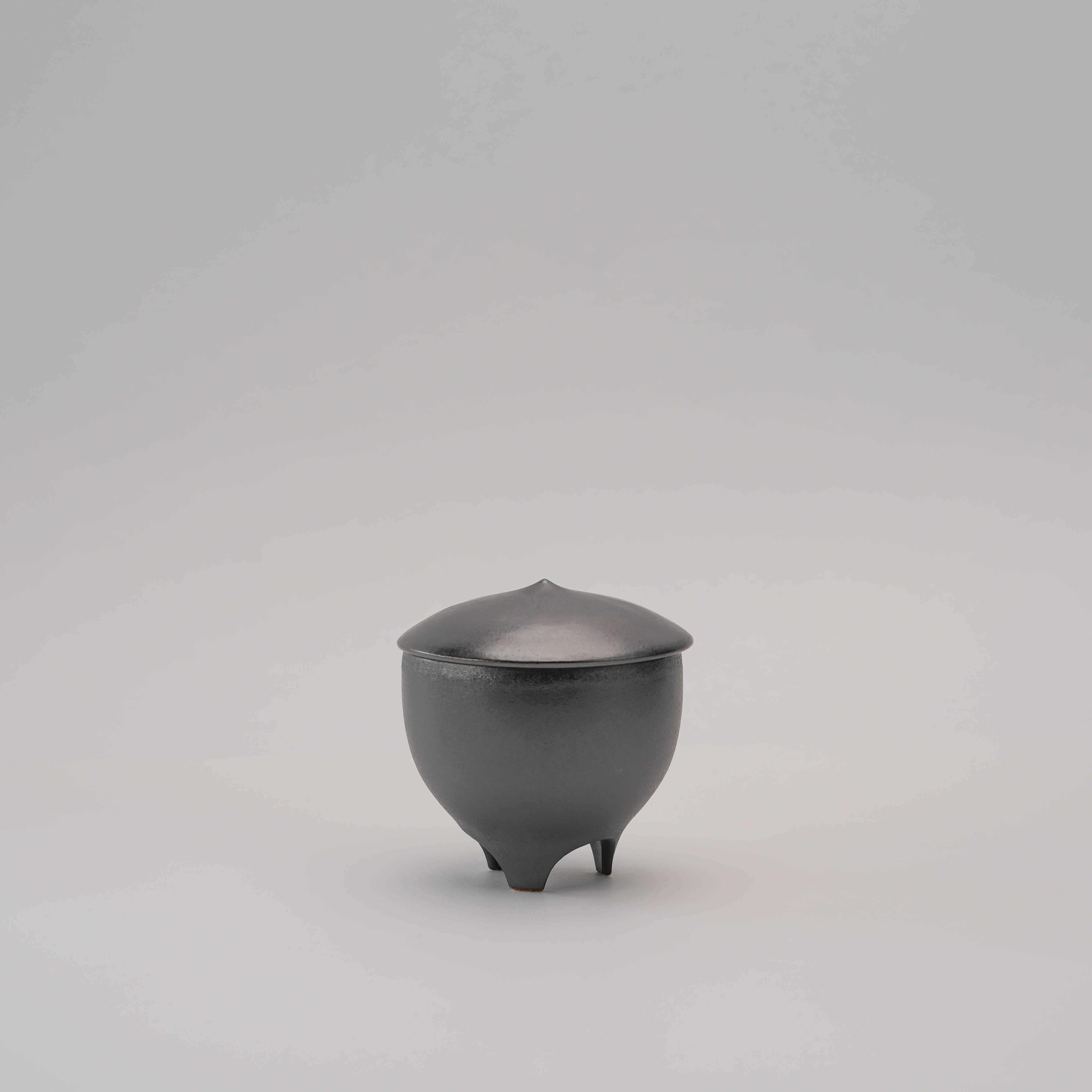 Shoyeido Incense Censer - Sumi with lid on, featuring a minimalist black ceramic design ideal for modern home fragrance decor.