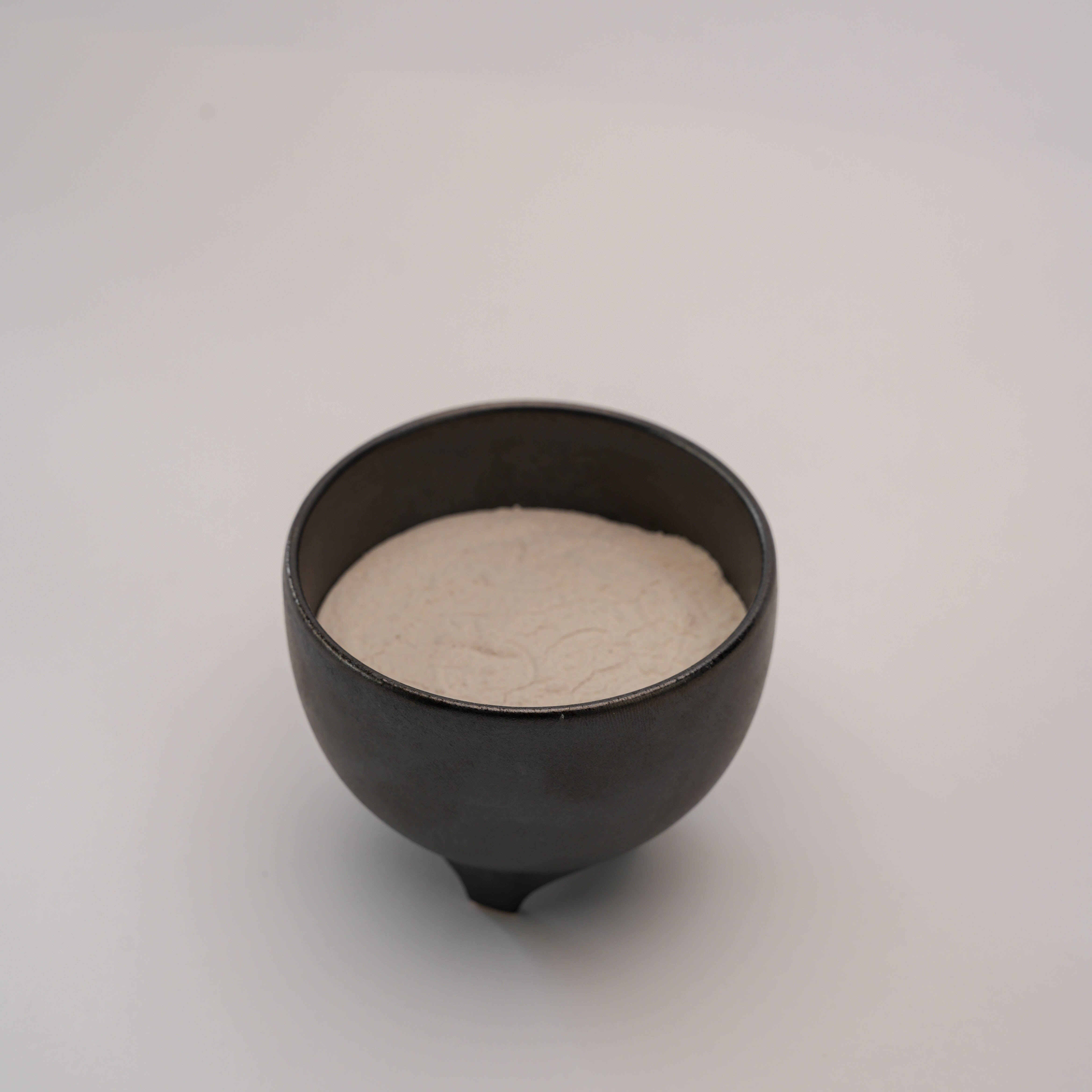 Open Shoyeido Incense Censer - Sumi filled with white ash, designed for holding incense sticks or coils in home fragrance setups.