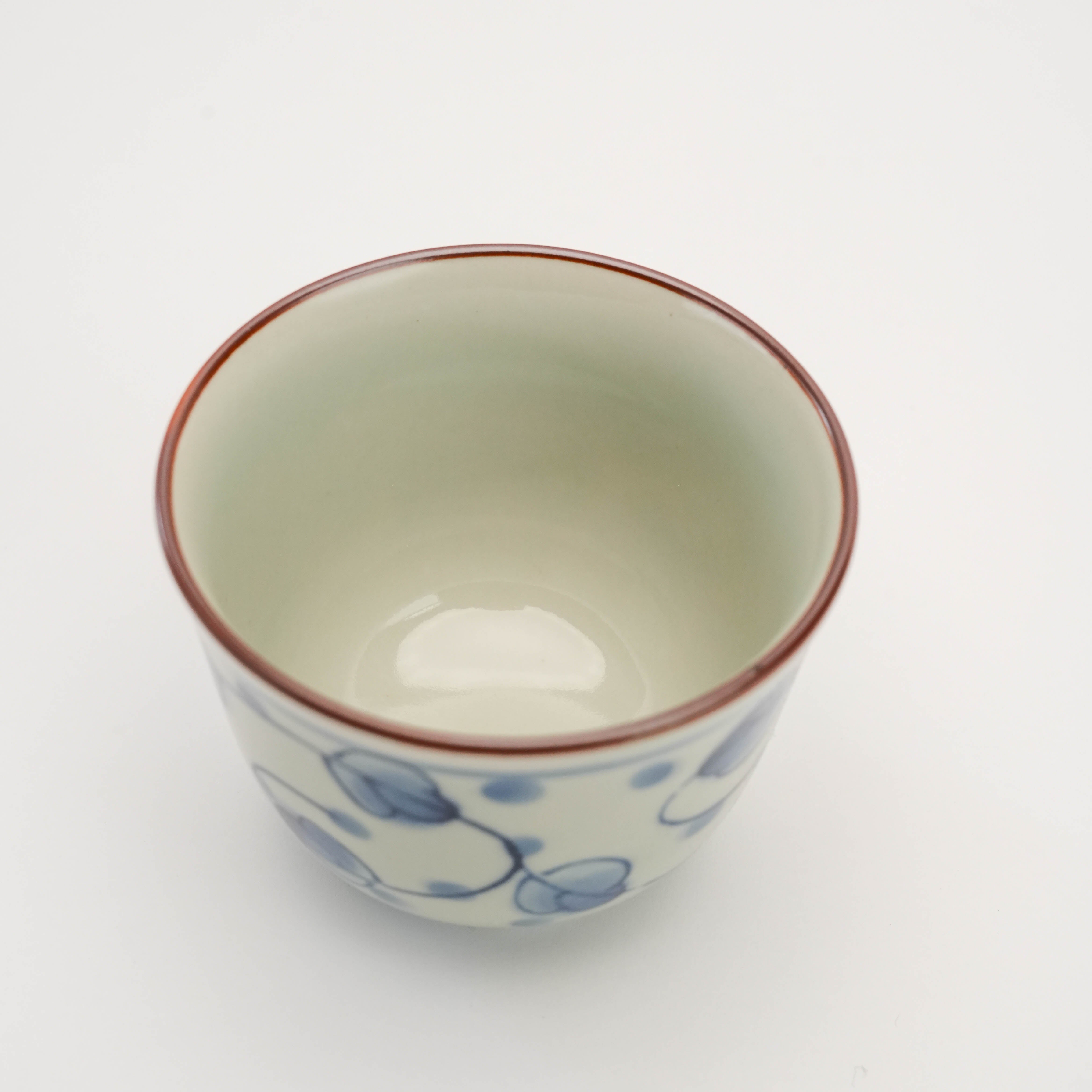 Top view of Miyakogusa Arita Ware Tea Cup showing smooth porcelain interior and red rim, ideal for home tea decor.