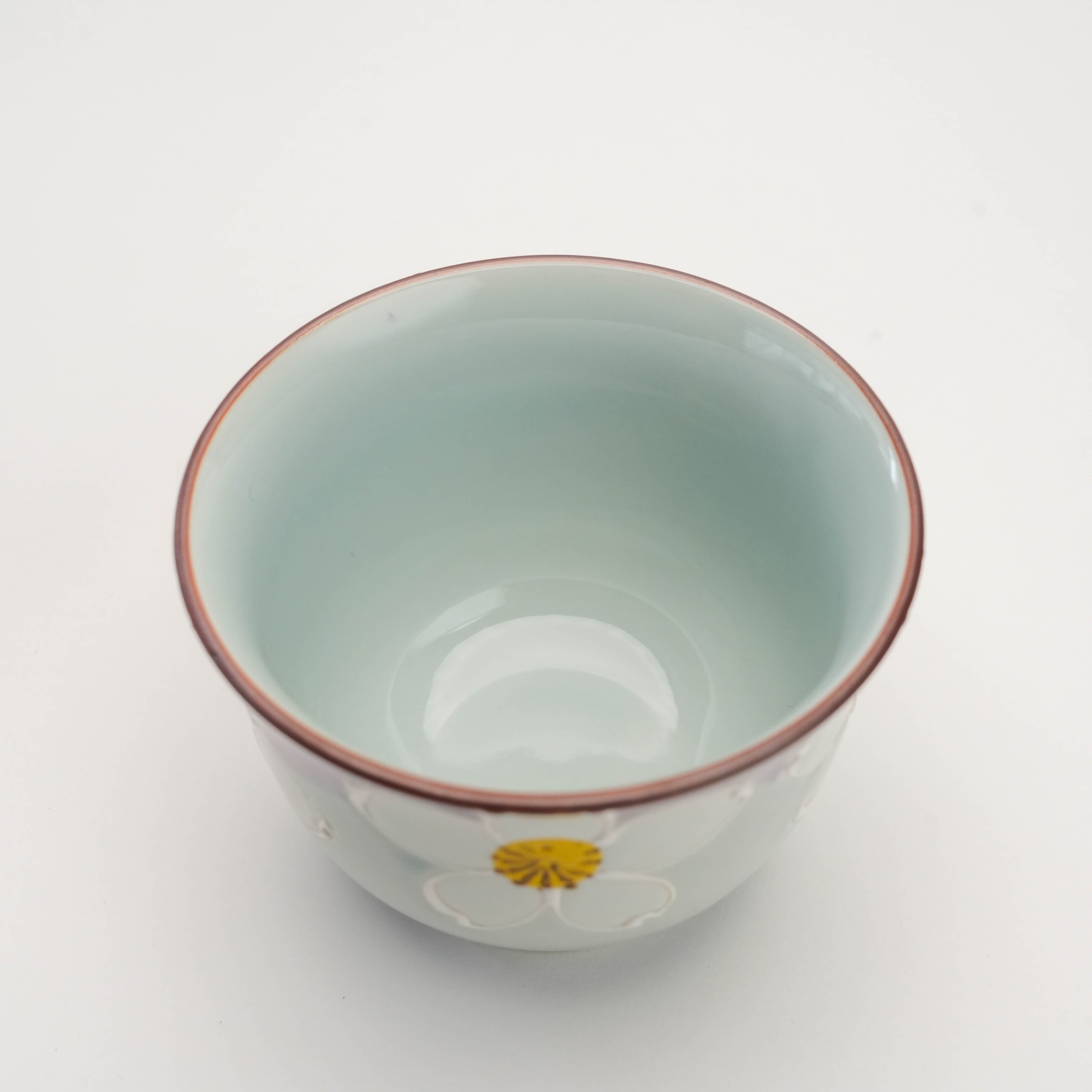Interior view of Arita Ware Urara Purple Sakura Tea Cup showing smooth celadon glaze and refined craftsmanship for green tea enjoyment.