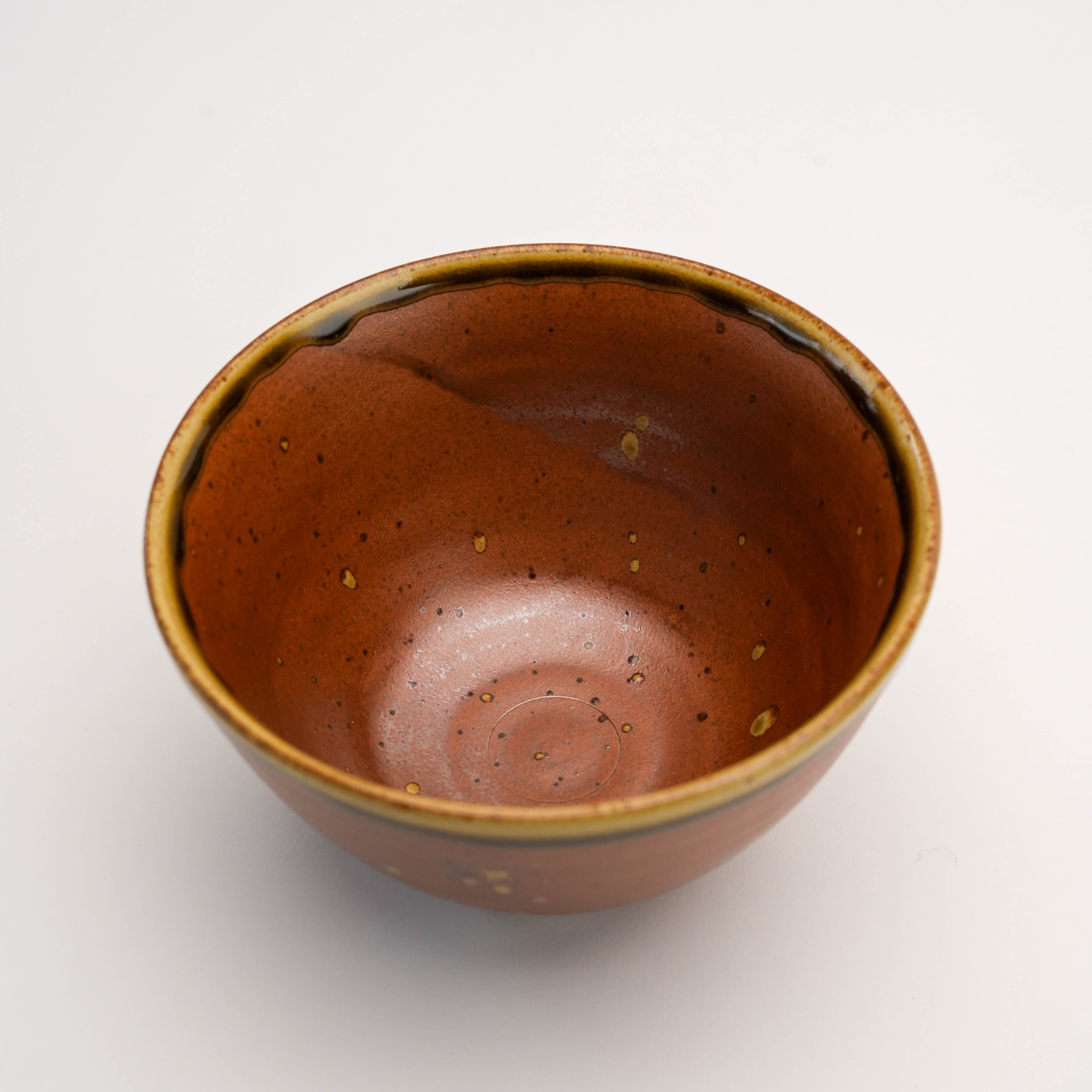 Top view of Arita Ware Fukukasu brown rice bowl, highlighting its smooth interior with speckled glaze and handcrafted finish.