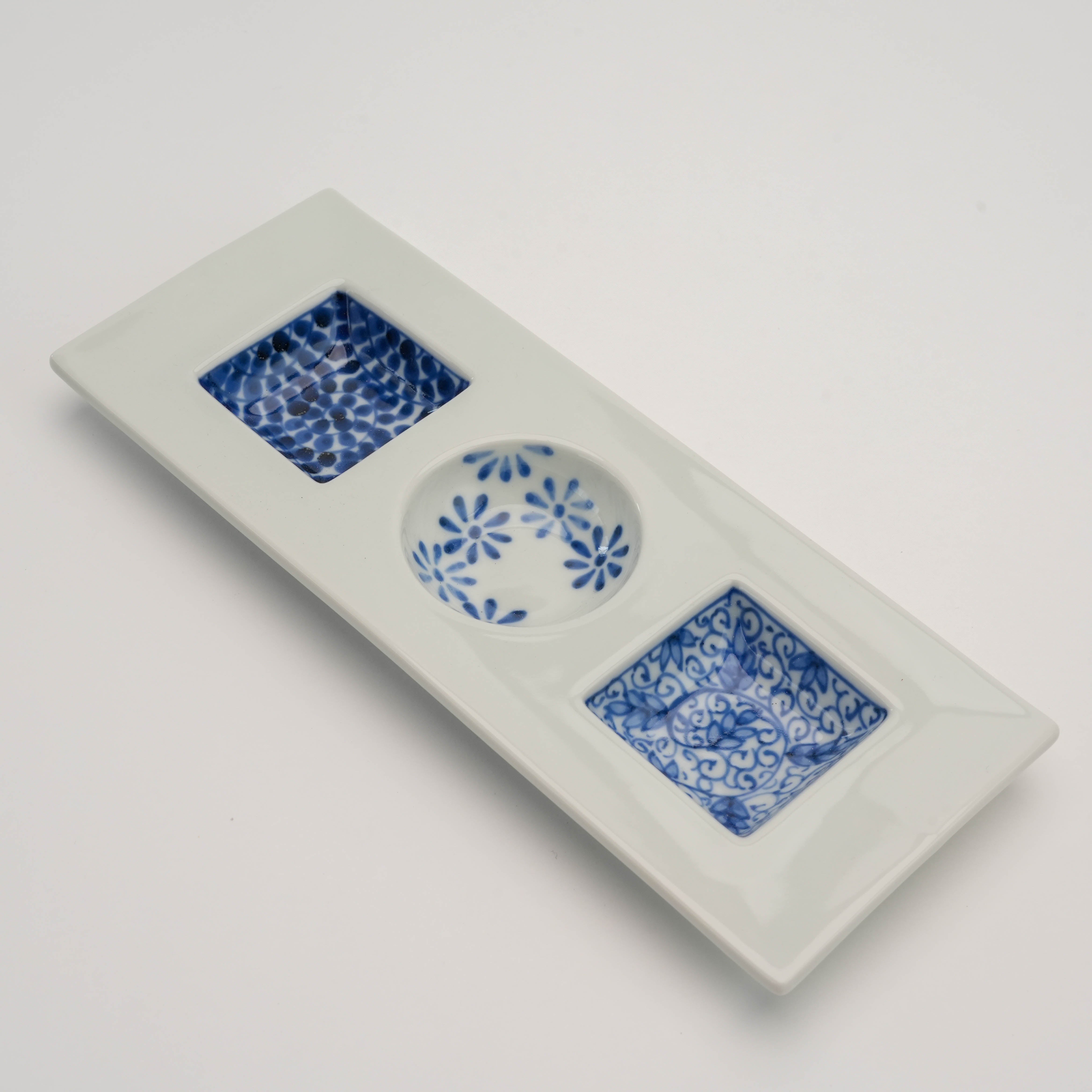 Angled top view of Sometsuke Serving Dish - Triple Dish with floral, dotted, and scroll designs, ideal for stylish table settings.