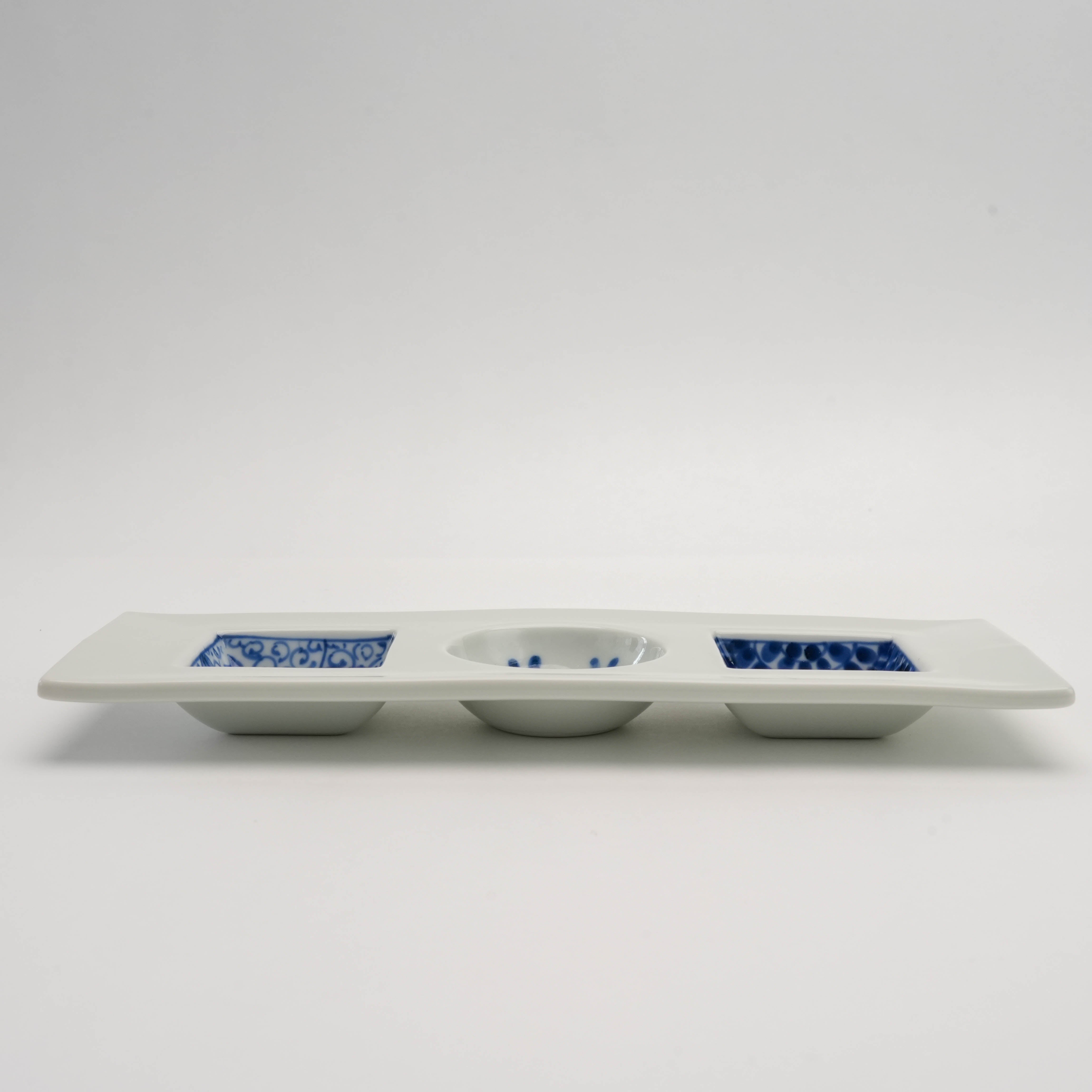 Side view of Arita Ware Sometsuke Triple Dish showing three distinct patterned compartments for elegant serveware presentation.