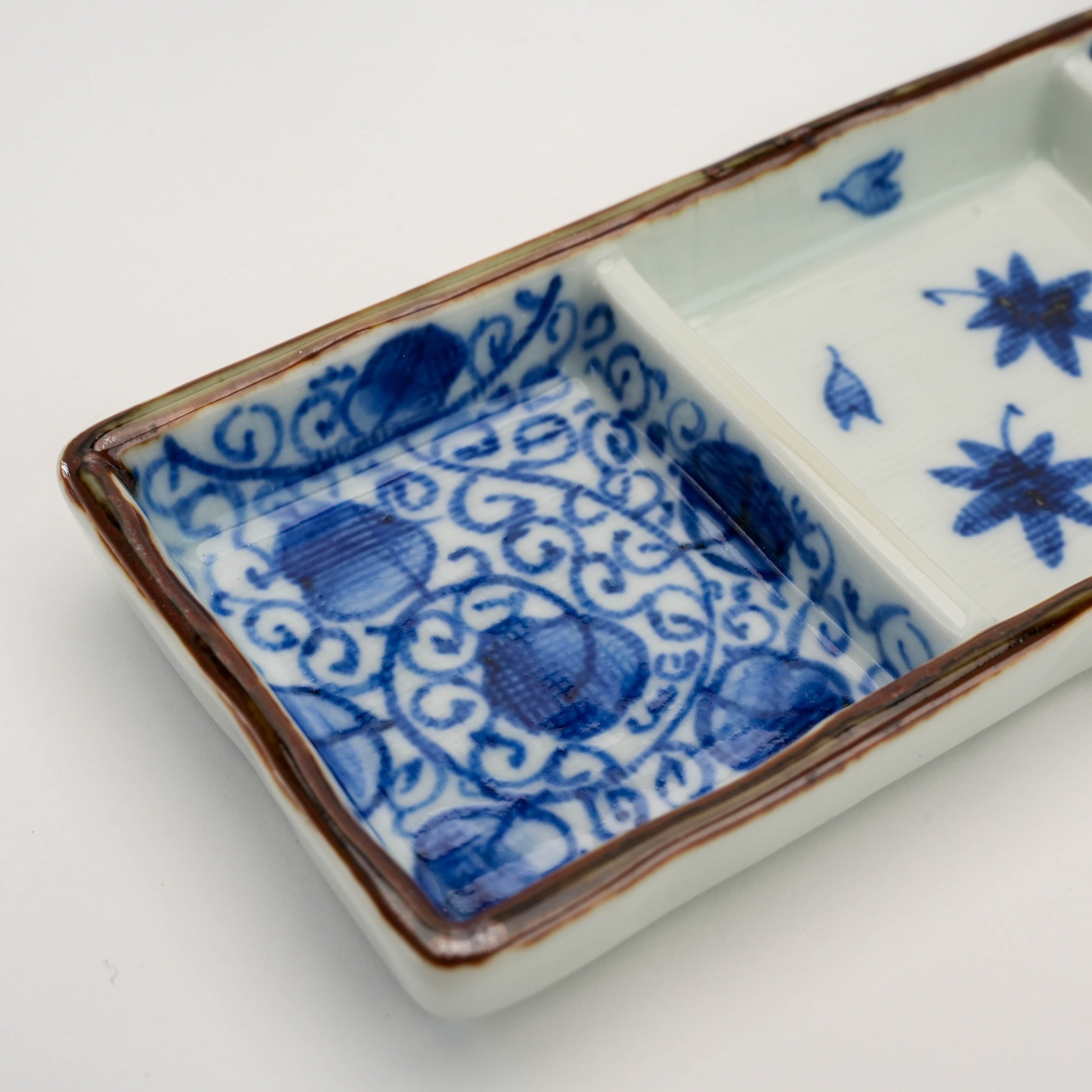 Close-up of Arita Ware Triple Pattern Dish showing intricate indigo floral scrollwork in one of the three sections, ideal for sauces or condiments.