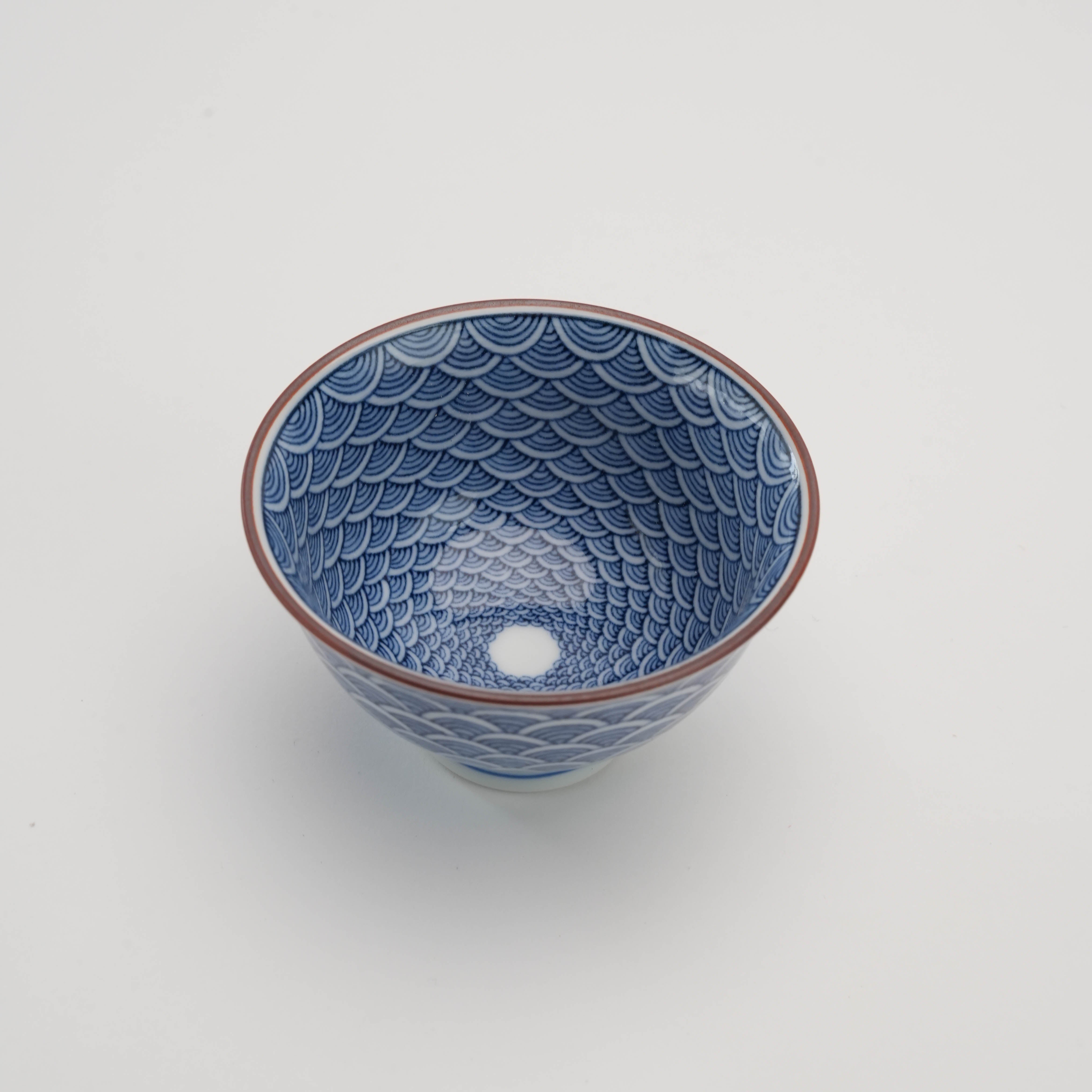 Top view of Arita Ware Seigaiha Tea Cup showcasing intricate hand-painted wave motifs inside the porcelain cup, perfect for tea enthusiasts.