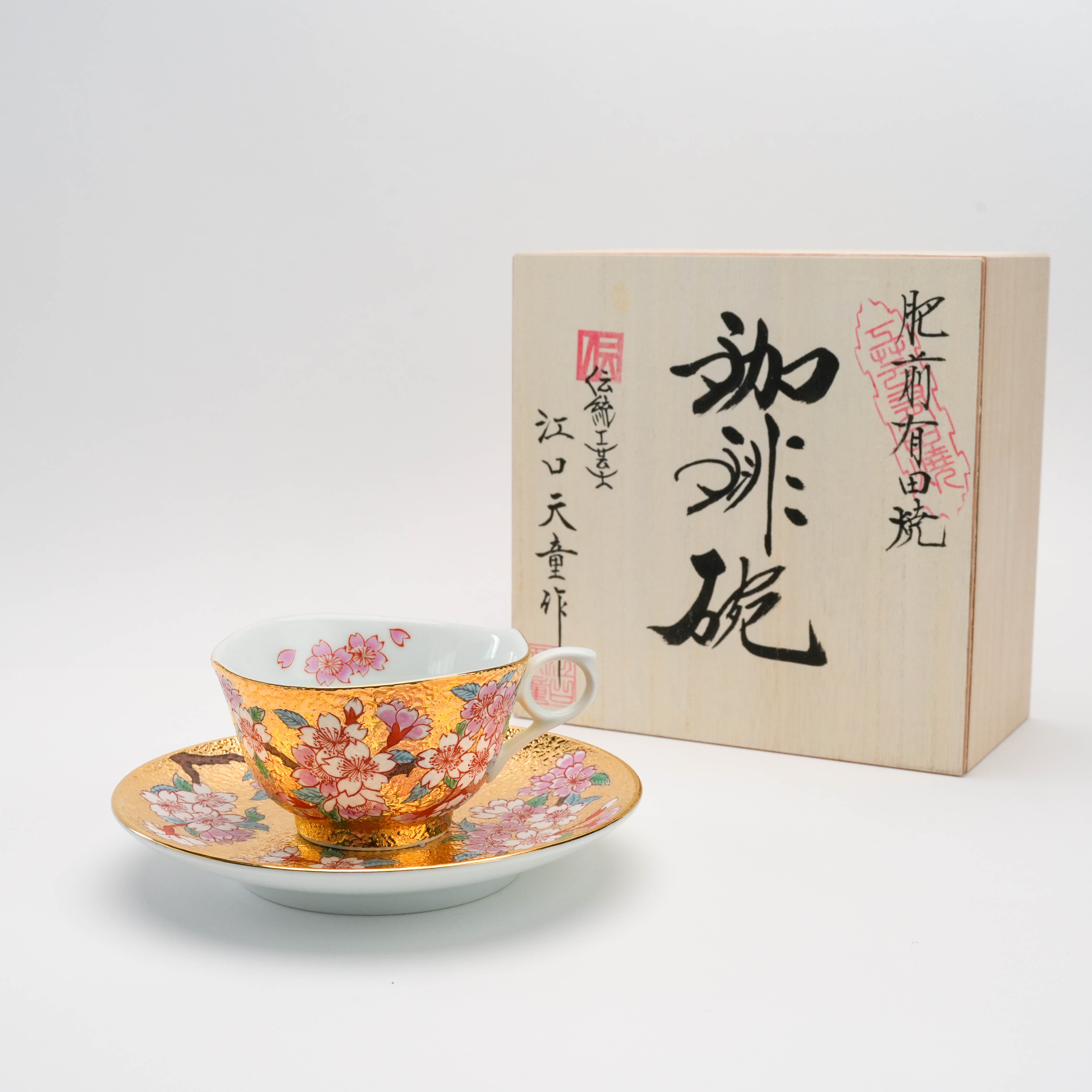 Gold Sakura Cup & Saucer by Tendou Eguchi with original wooden box. Arita Ware tea set showcasing Japanese craftsmanship and floral artistry.