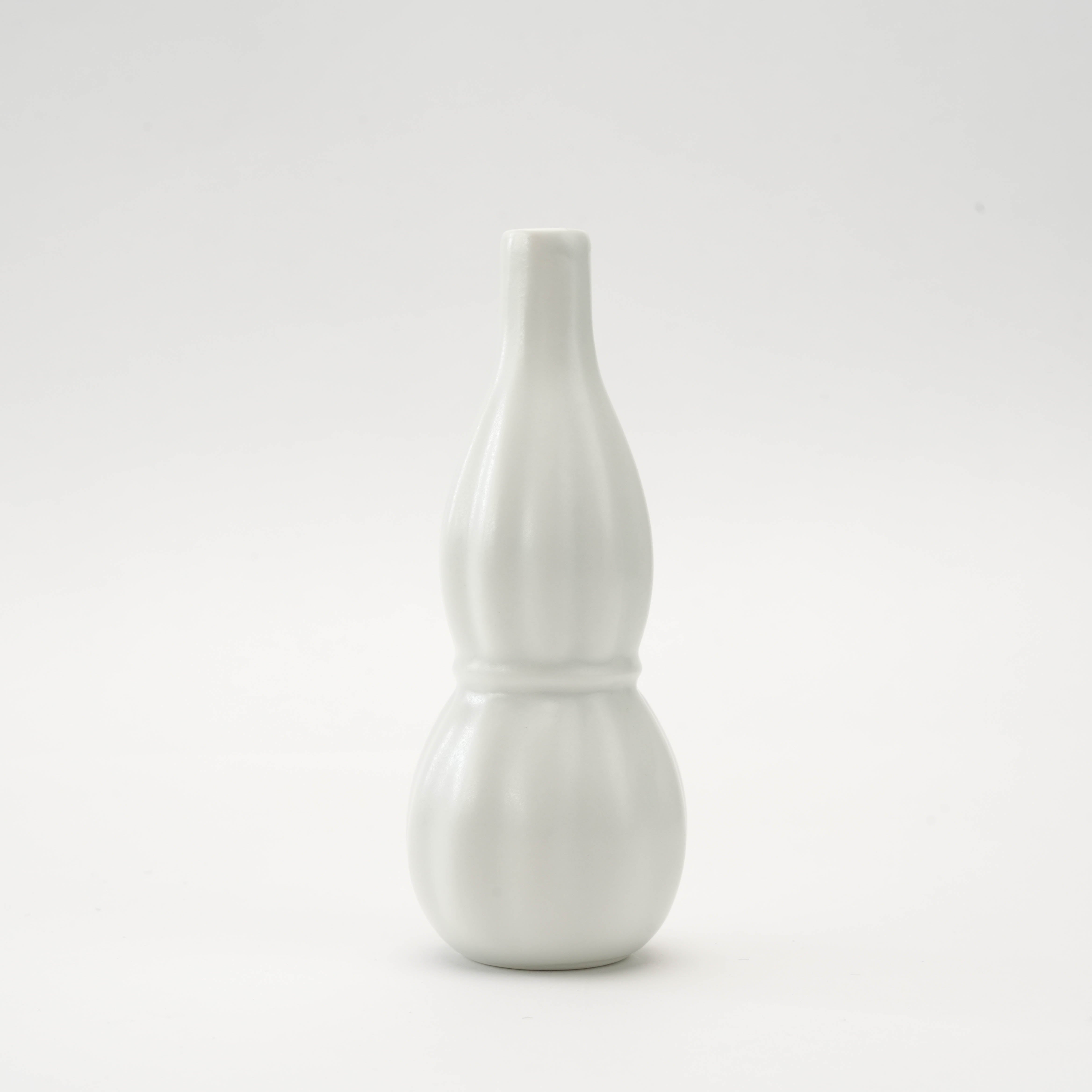 Elegant Arita Ware White Ribbed Flower Vase featuring tactile fluting and a glossy ceramic finish, handcrafted in Japan for modern interiors.