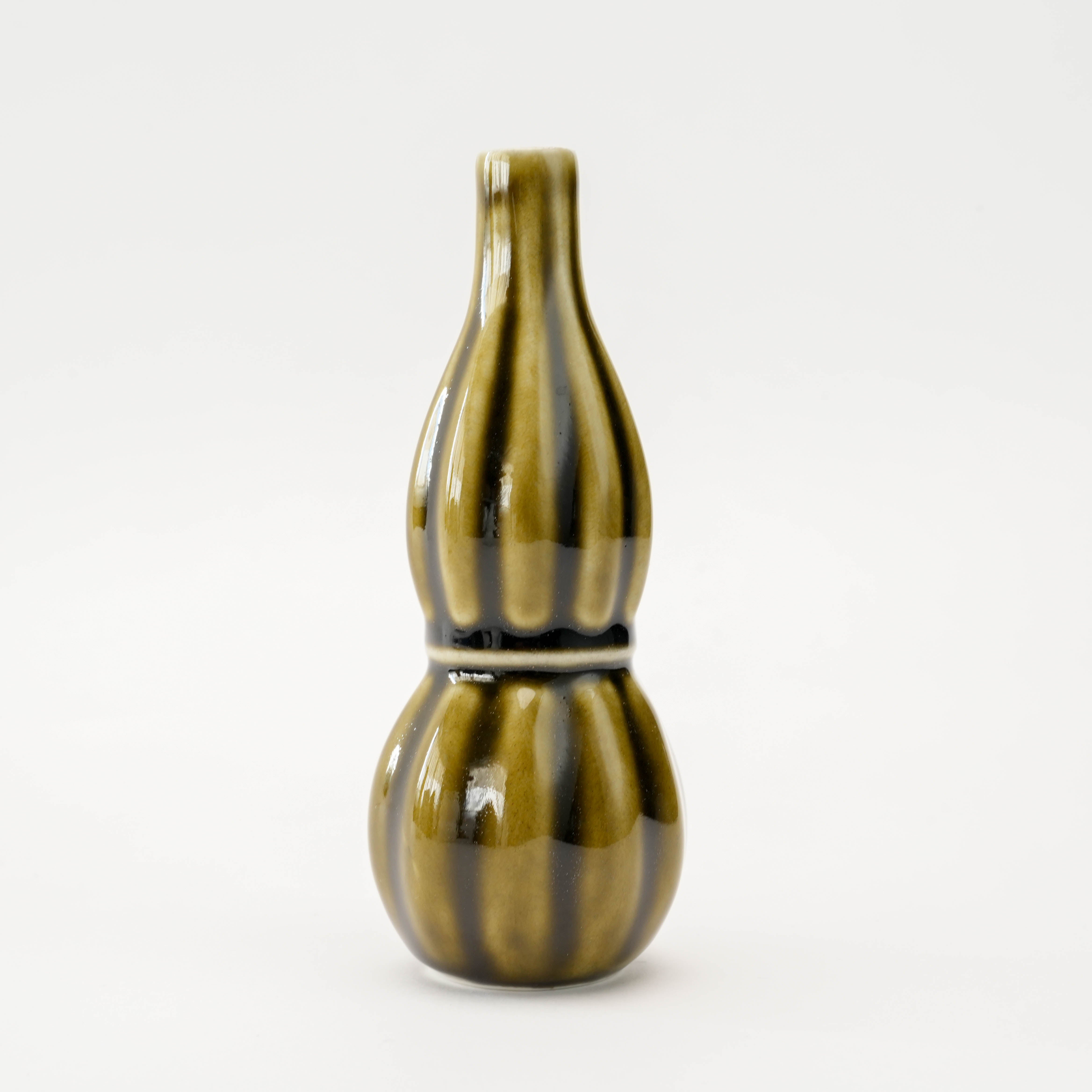 Close-up of Ribbed Flower Vase - Green Olive Design in ceramic, showcasing its glossy glaze and Japanese craftsmanship.
