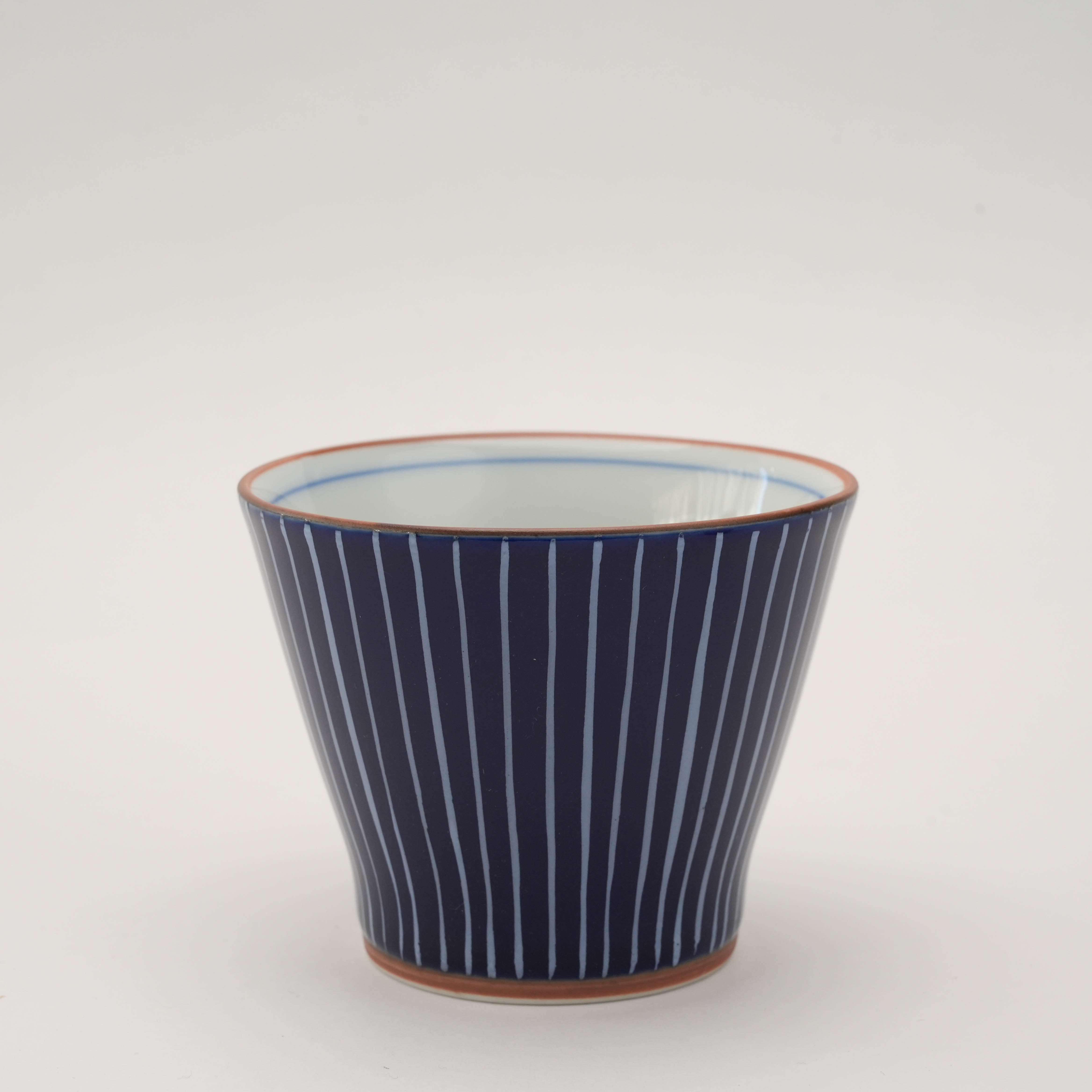 Shiraito Yunomi Teacup in deep blue glaze with fine hand-painted white lines. Japanese craftsmanship ideal for tea lovers.