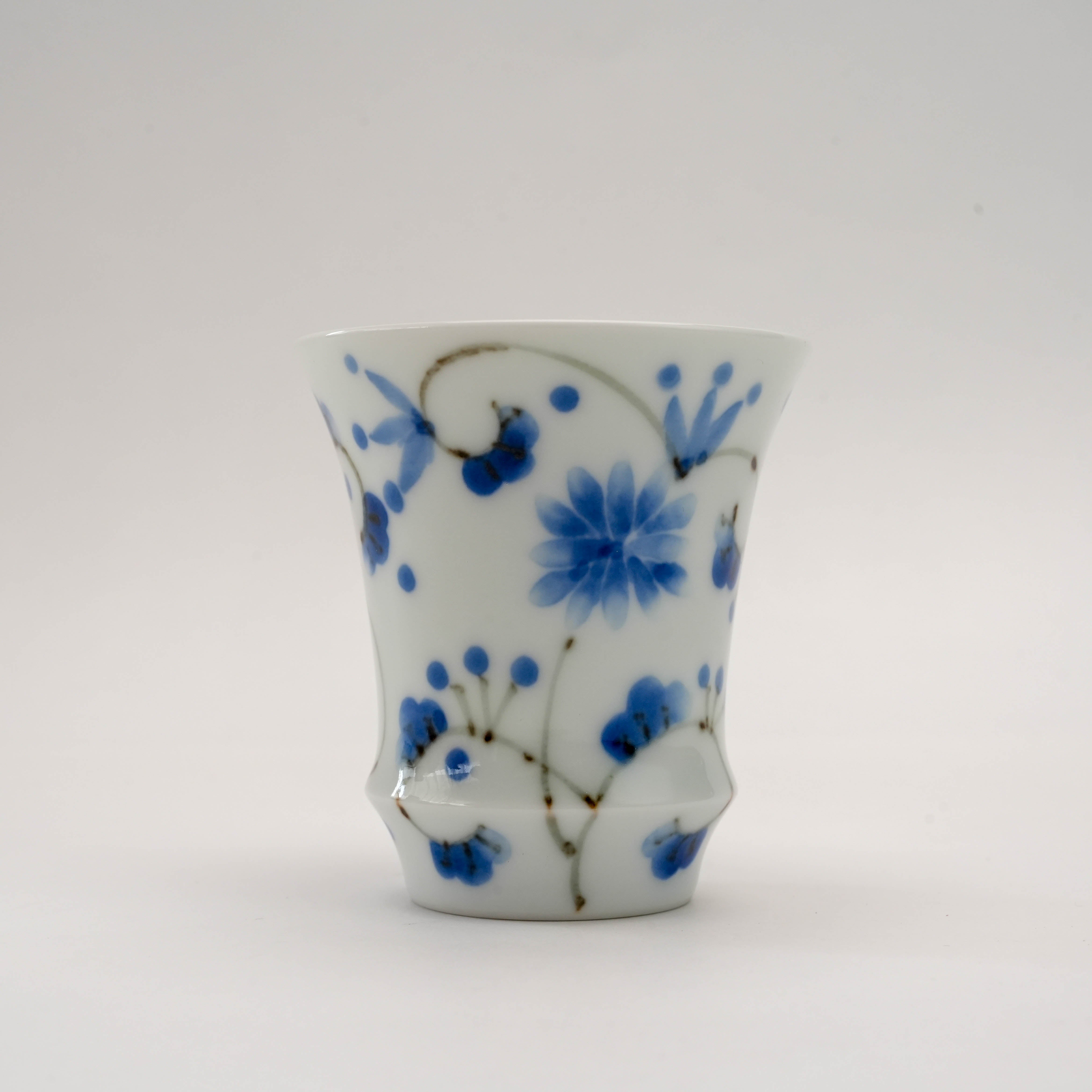 Elegant Arita Ware Sake Glass - Hotaru Arabesque with soft indigo floral motifs and flared rim, perfect for premium sake presentation and gifting.
