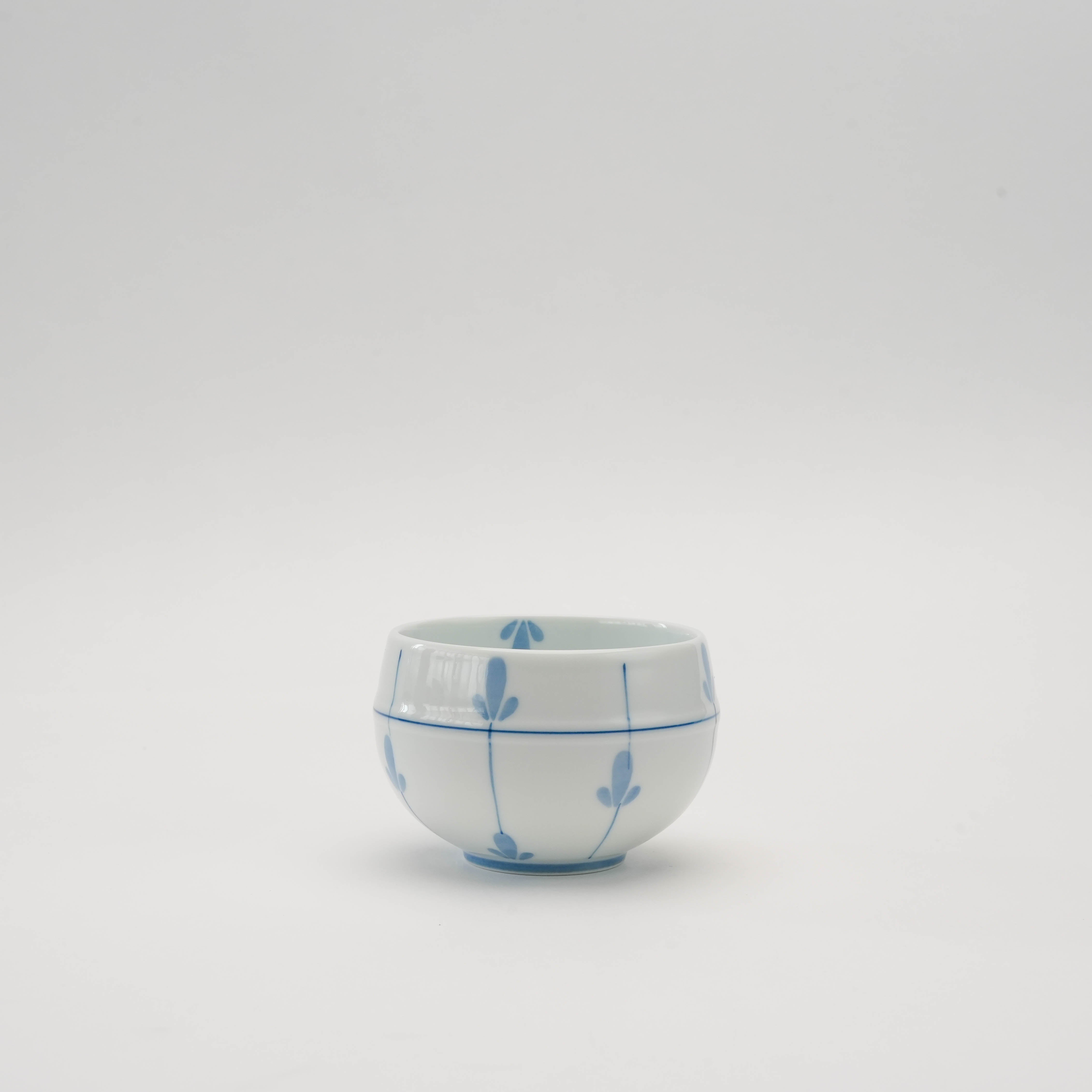 Arita Sencha Tea Cup - Sprout Design features a rounded porcelain form with delicate blue sprout motifs, ideal for Japanese tea rituals.
