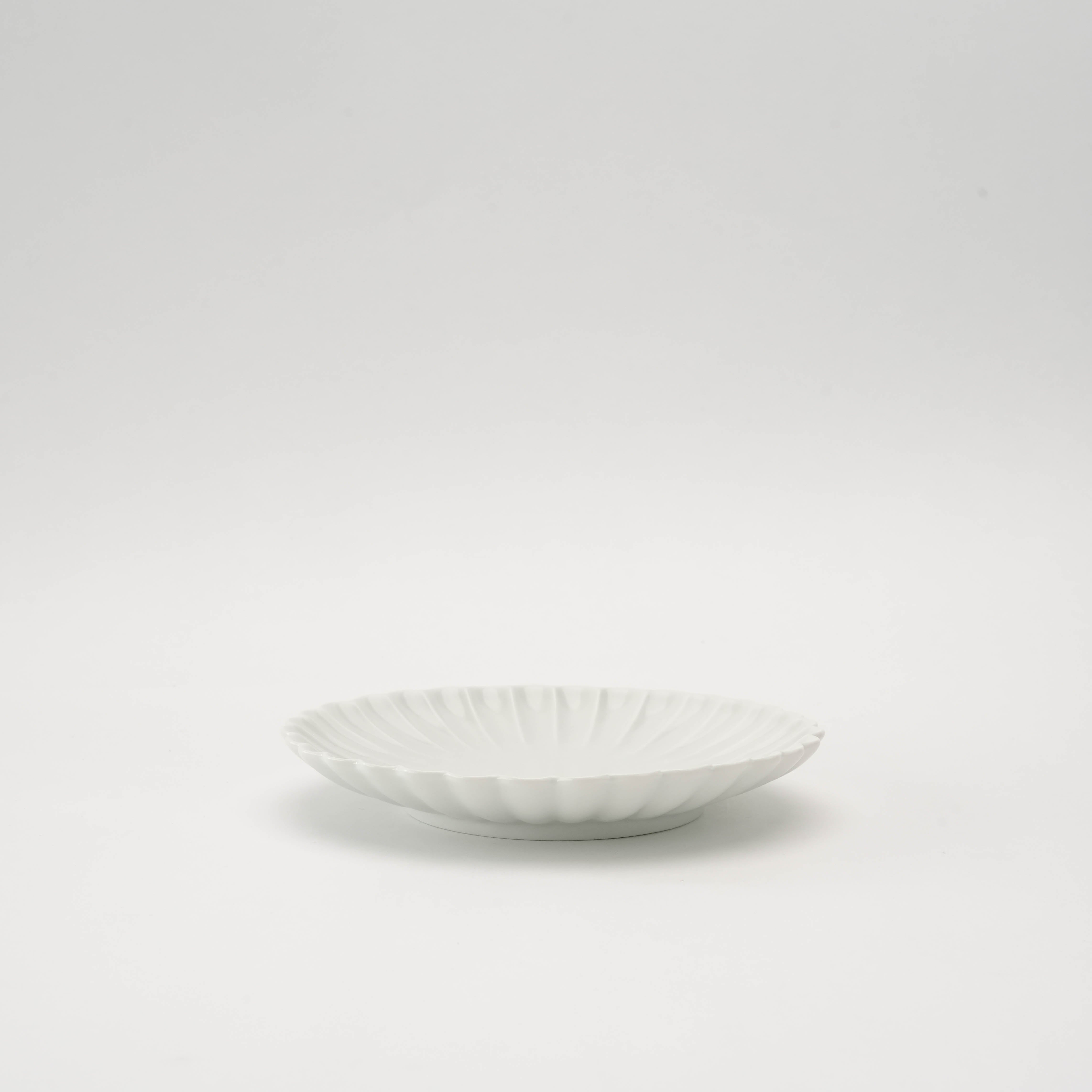 Side view of Arita Ware Chrysanthemum Plate, 15cm matte white porcelain with traditional kikubori petal pattern, perfect for elegant table settings.