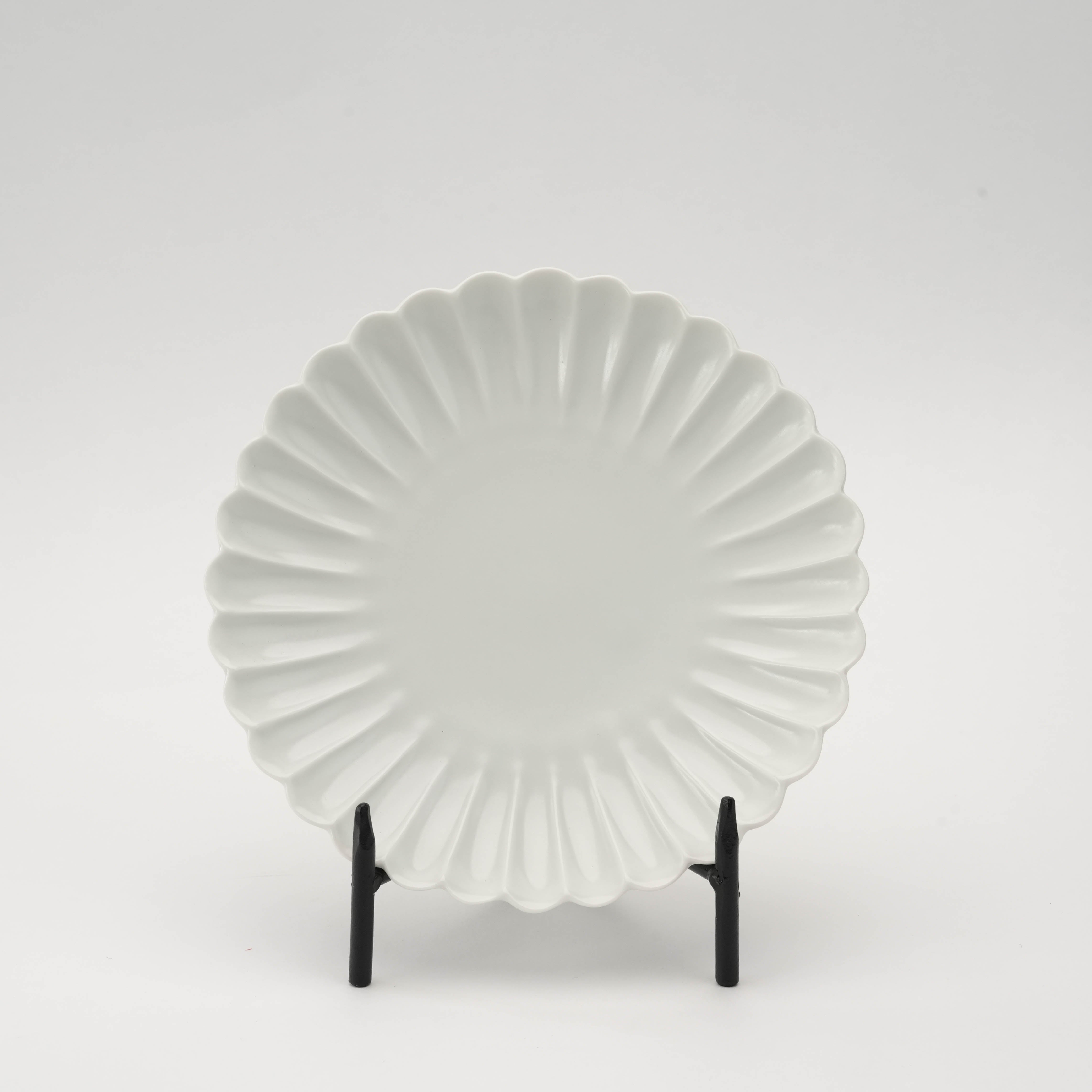 Arita Ware Chrysanthemum Plate in matte white, 15cm diameter, displayed upright to show scalloped floral design. Ideal for serving sweets or appetizers.