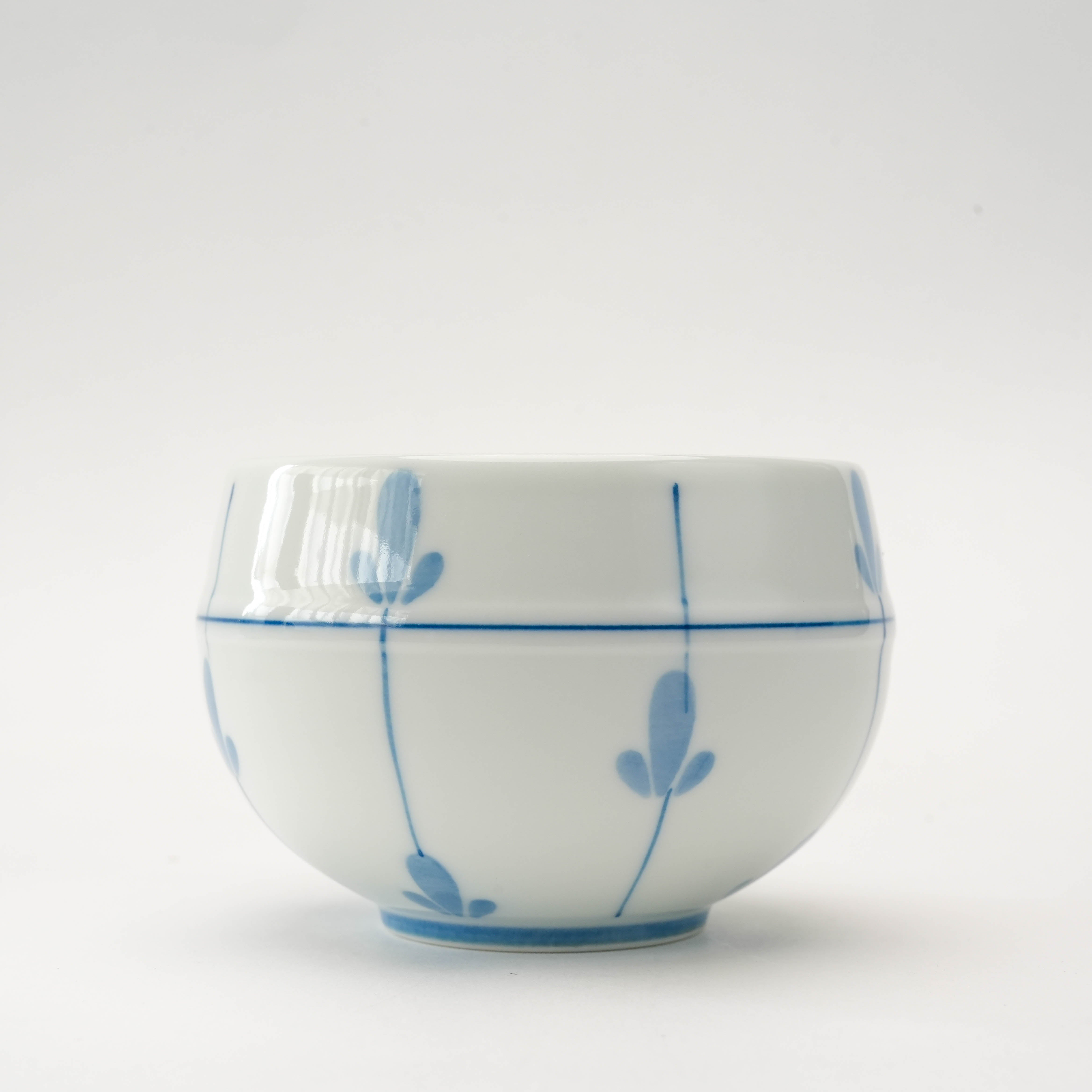 Close-up of Arita Ware Sprout Rounded Sencha Tea Cup showcasing fine blue sprout patterns and traditional Arita craftsmanship.