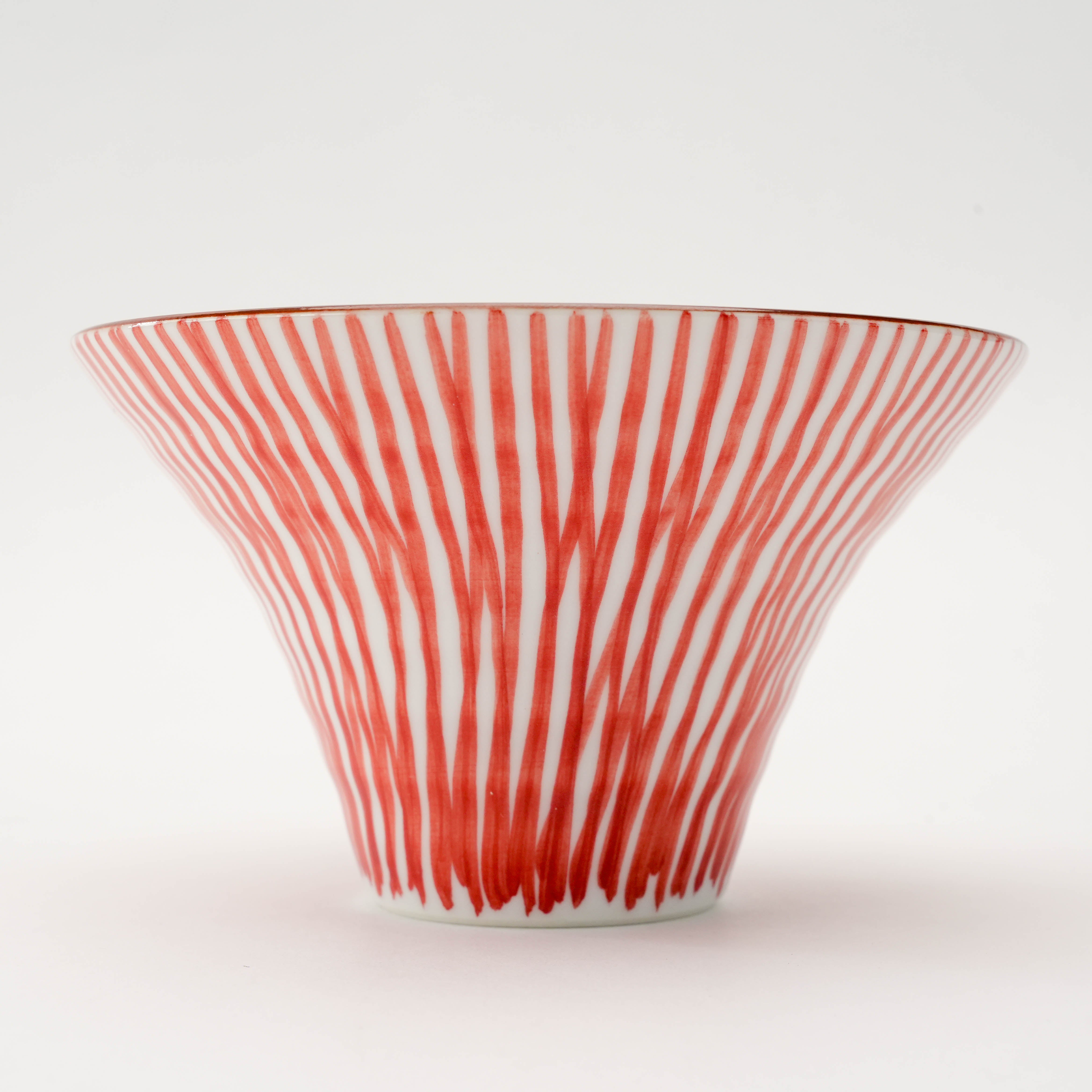 Close-up of red Arita Ware Flared Bowl - Small Bowl | 12cm Hand-Painted with vertical Tokusa brushstrokes and flared rim detail.