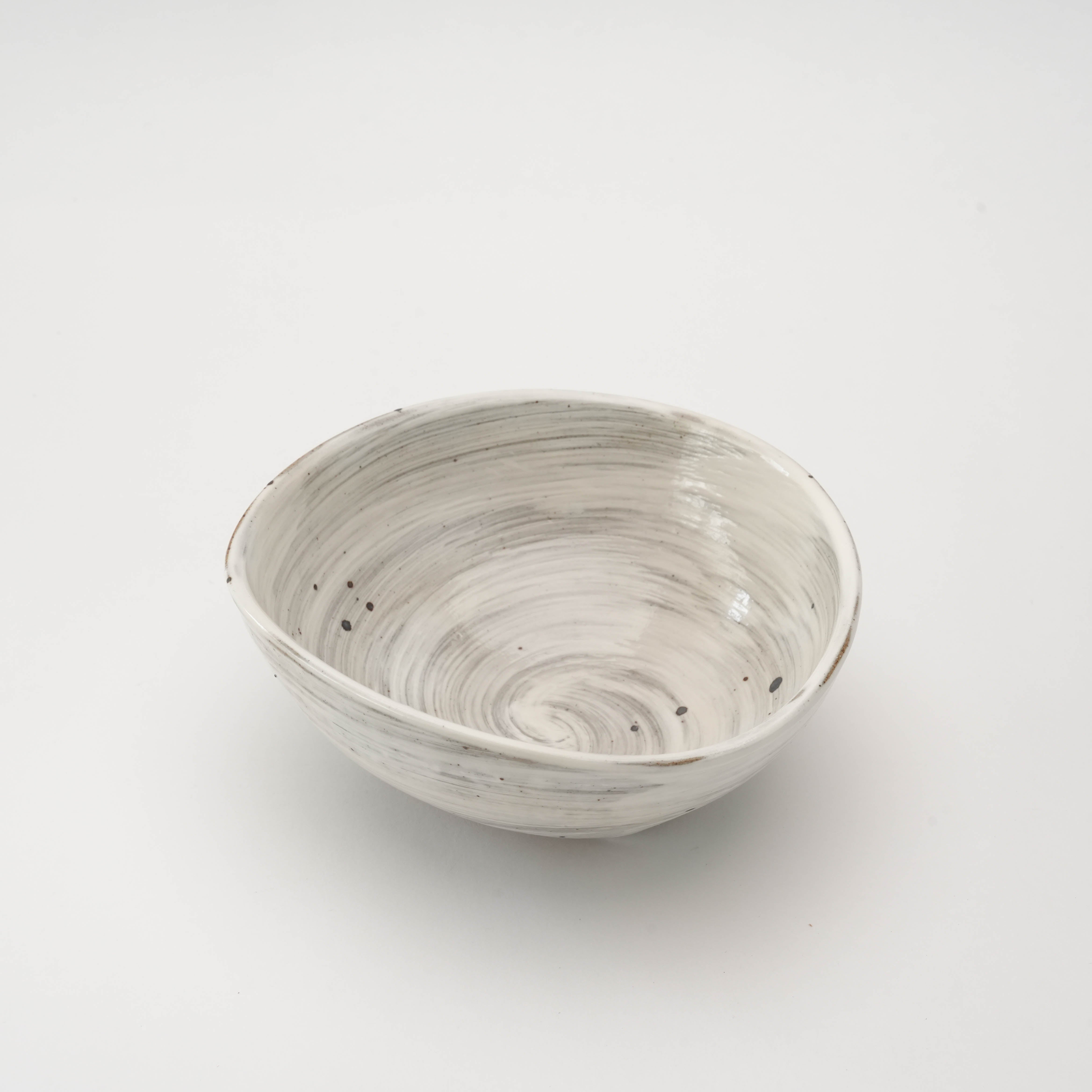 Interior view of Kimikage Triangular Bowl showcasing its smooth, hand-brushed glaze and unique clay texture for elegant table settings.