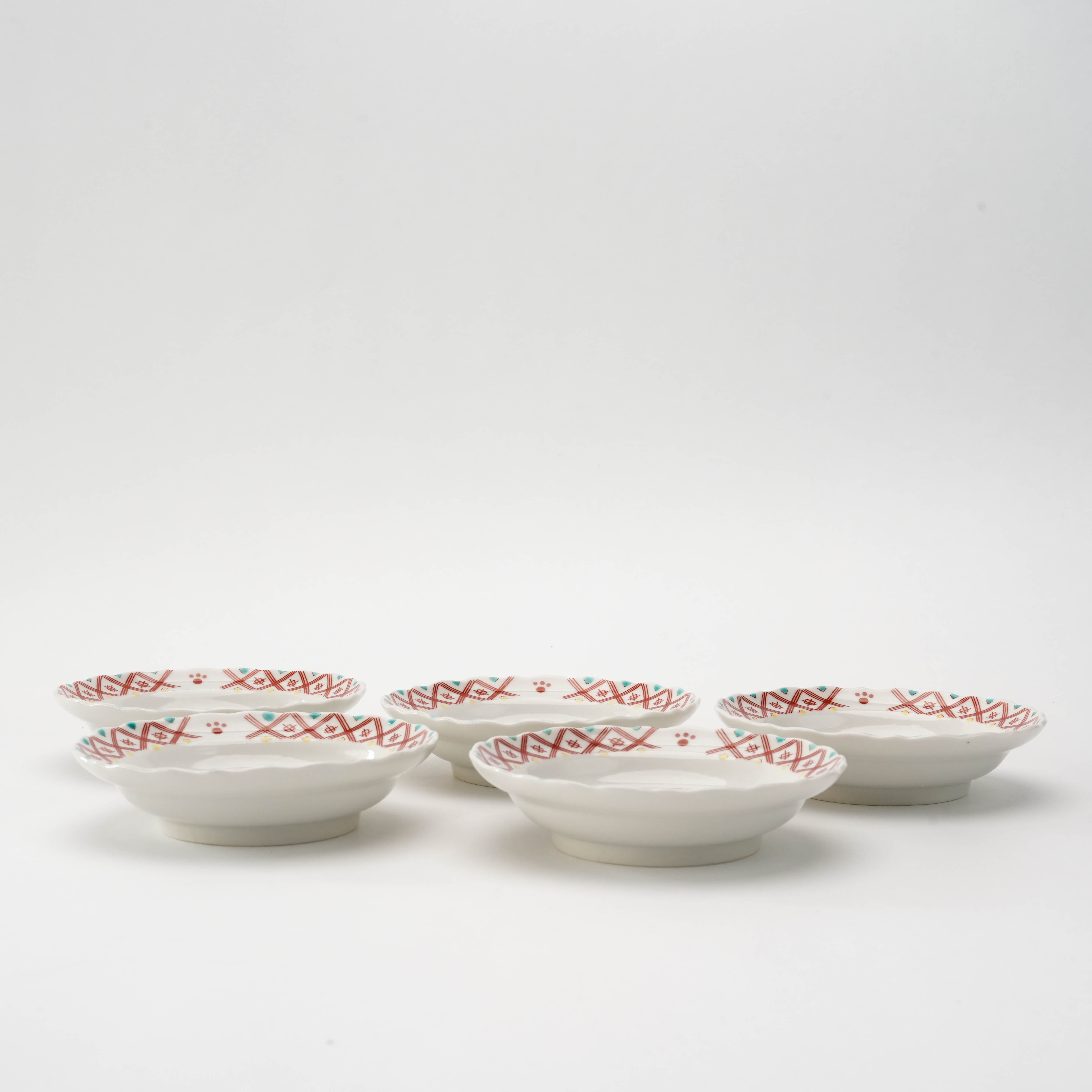 Side view of Kutani Ware Cat Mini Set-Small Plate Set showing the shallow depth and detailed red patterned rims of the 5 porcelain plates.