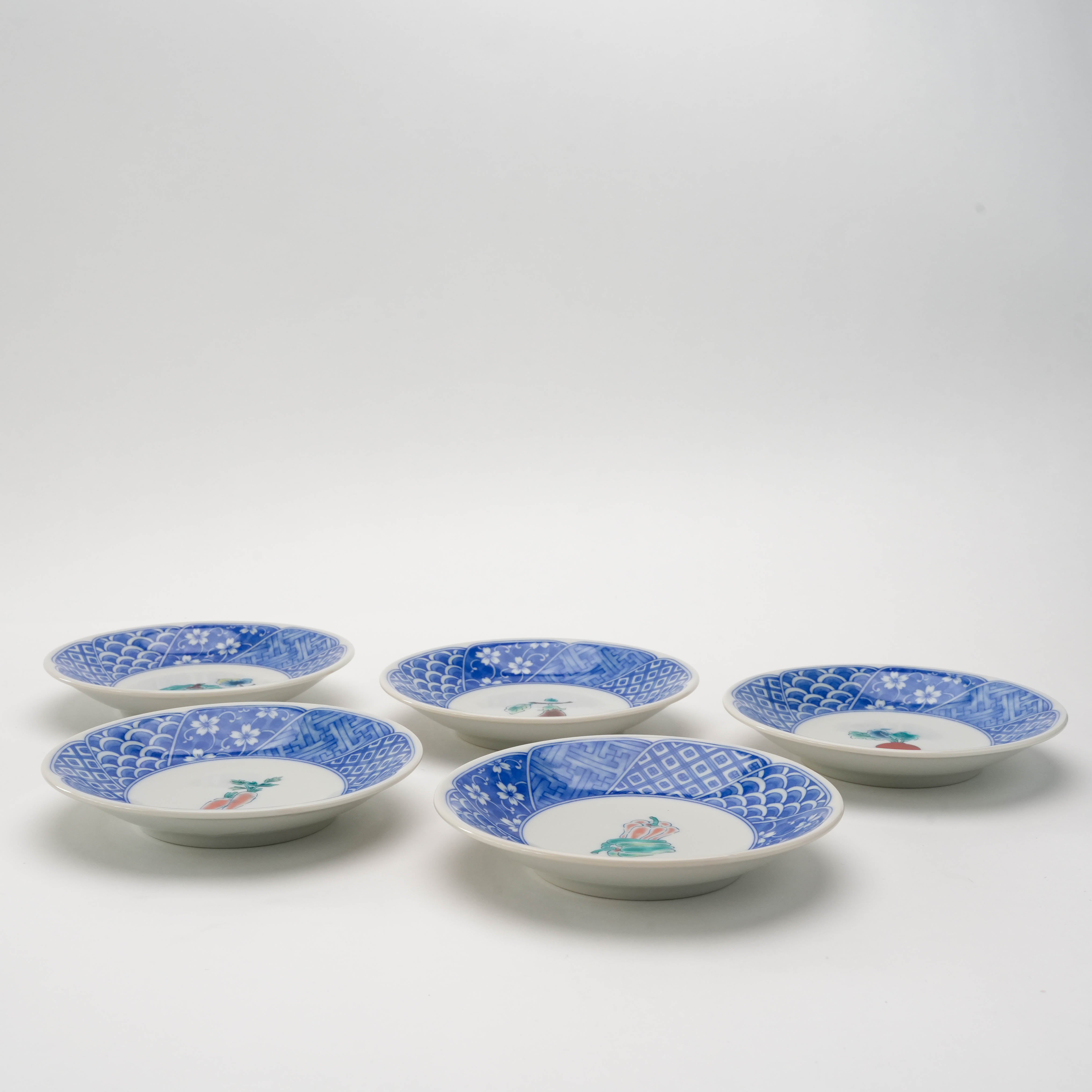 Side view of Kutani Ware Blue Rim Vegetable Small Plate Set, showcasing elegant curvature and traditional Japanese patterns.