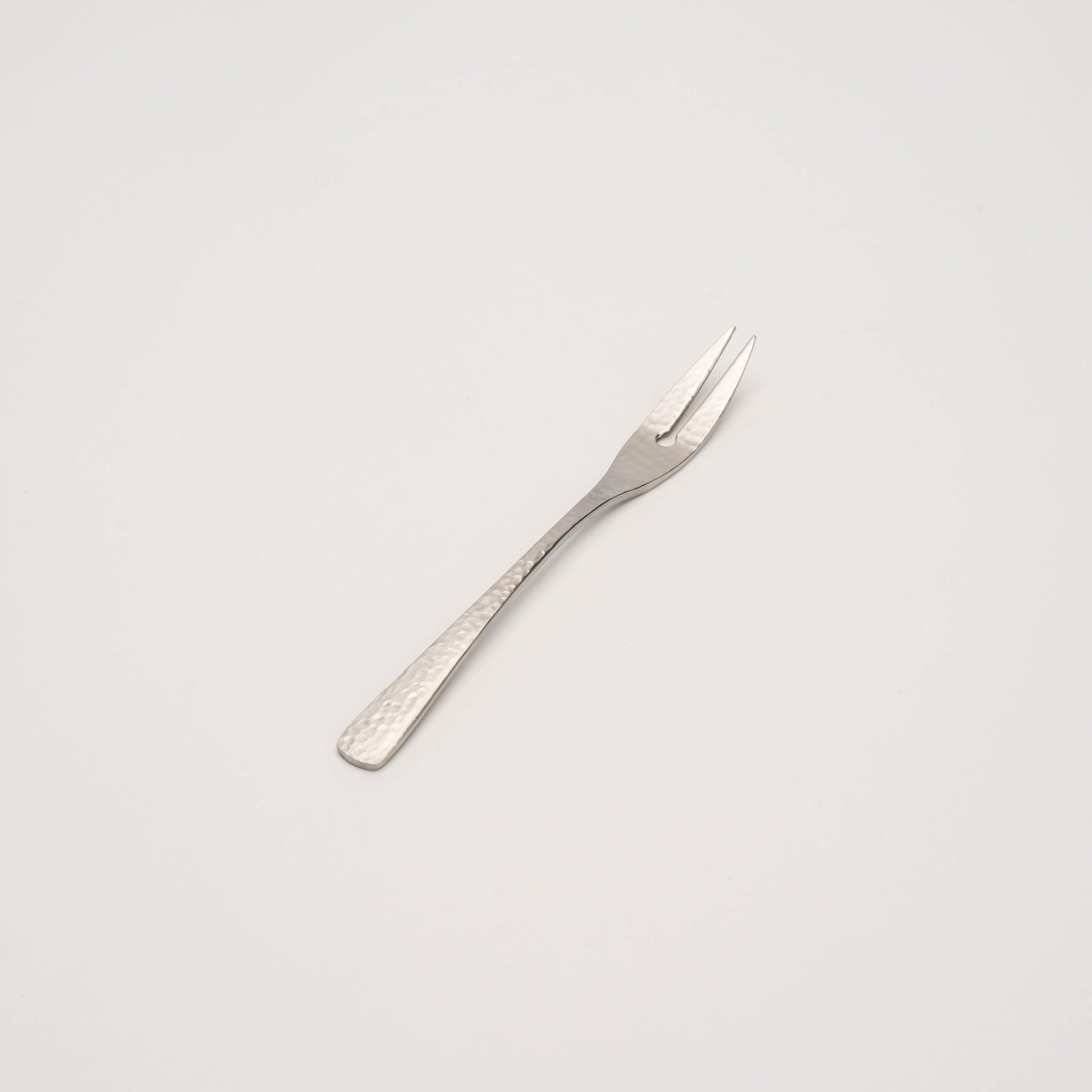 Nagomi Wafu Fork - Hammered Finish in Japanese stainless steel, ideal for elegant fruit and dessert presentation in modern barware settings.