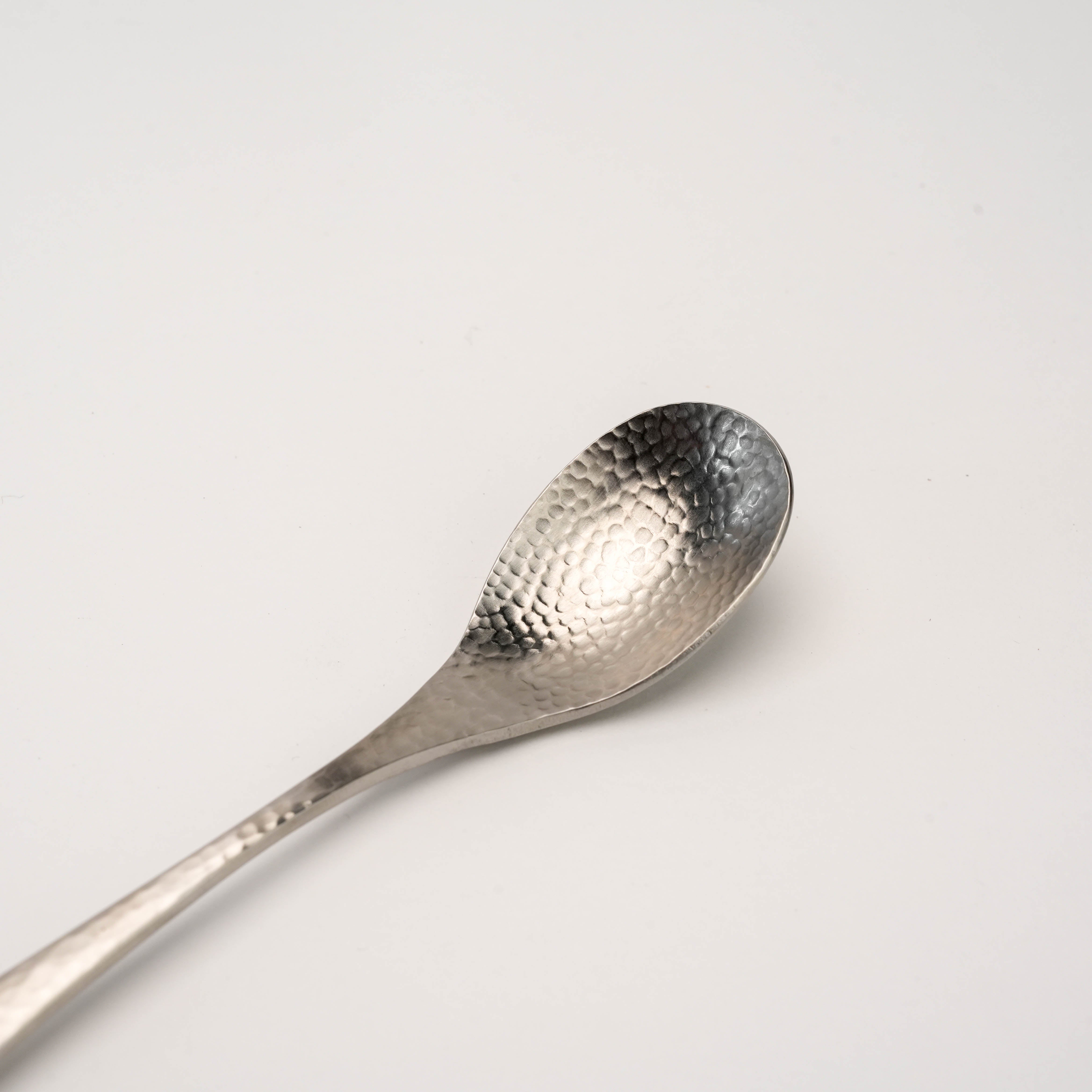 Close-up of the Tsubamesanjo Nagomi Wafu Hammered Spoon showing detailed hammered finish, perfect for elegant tea service.
