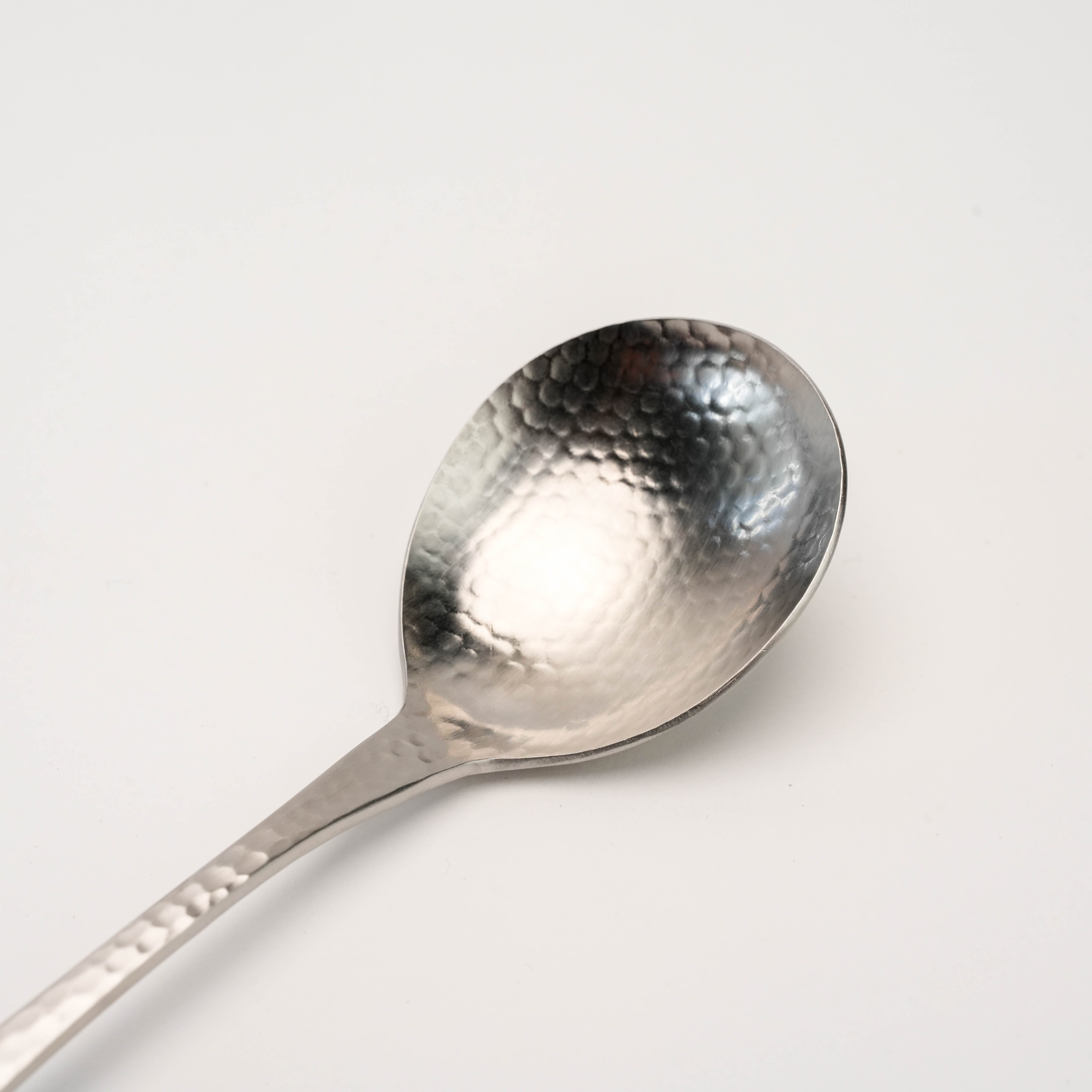 Close-up of the Tsubamesanjo Nagomi Wafu Hammered Soup Spoon showcasing its textured hammered bowl, crafted for refined Japanese tableware aesthetics.