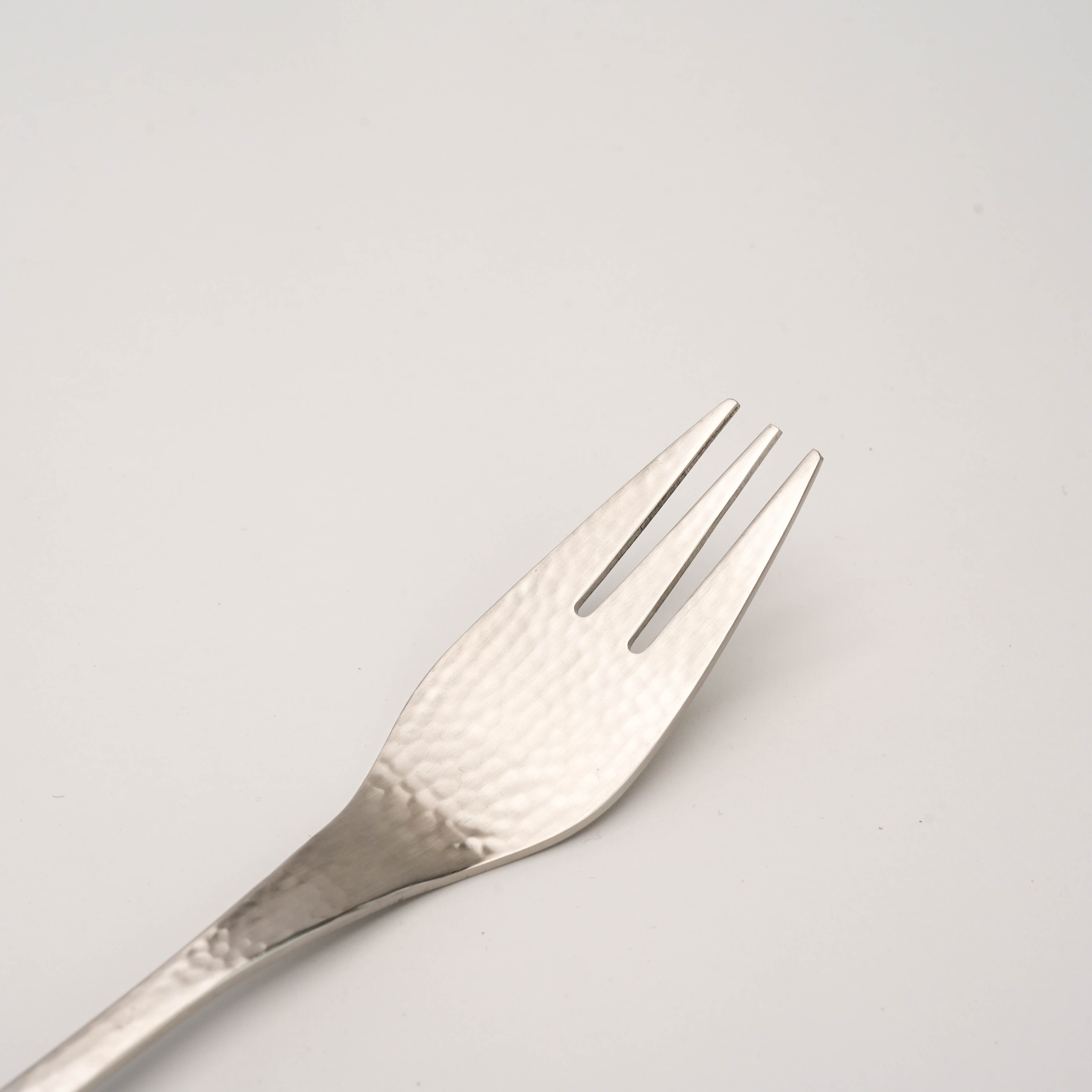 Close-up of Tsubamesanjo Nagomi Wafu Hammered Fork showing detailed hammered finish and fine craftsmanship in Japanese stainless steel flatware.