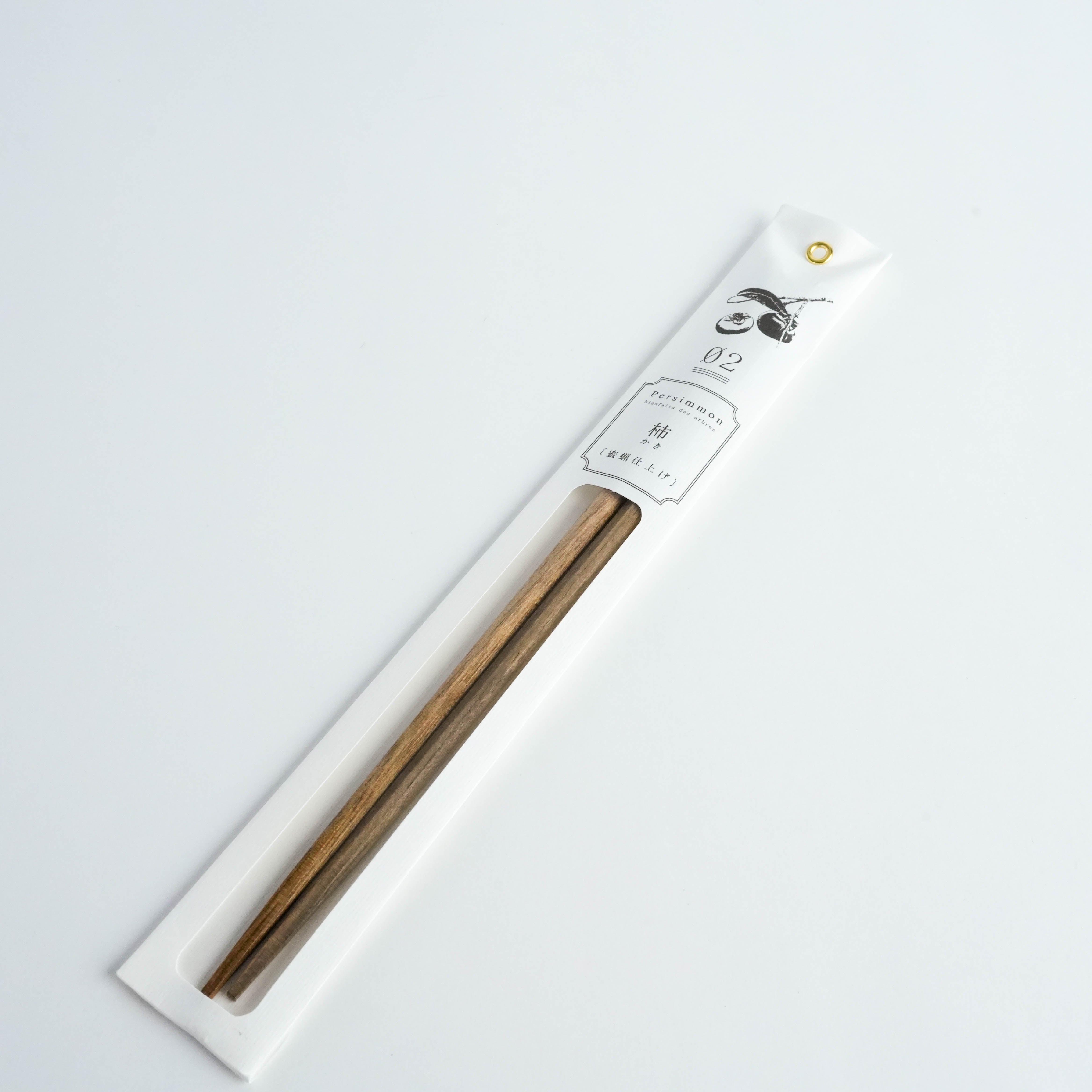 Kawai Tetoca Chopsticks - Persimmon Wood in eco-friendly packaging, featuring natural wood grain and minimalist Japanese design.