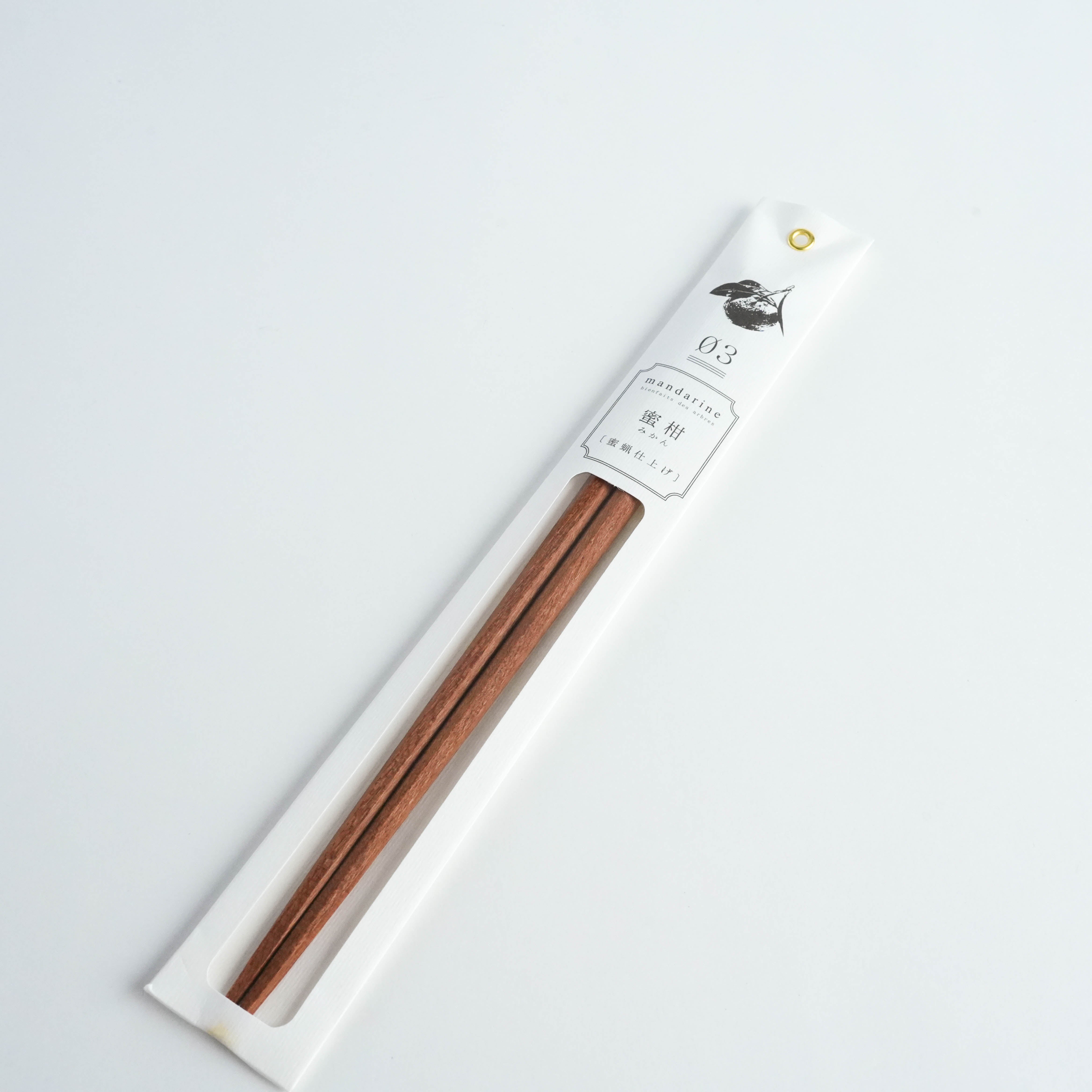 Kawai Tetoca Chopsticks - Mandarine Wood in elegant white packaging with botanical illustration, showcasing natural finish and ergonomic design.
