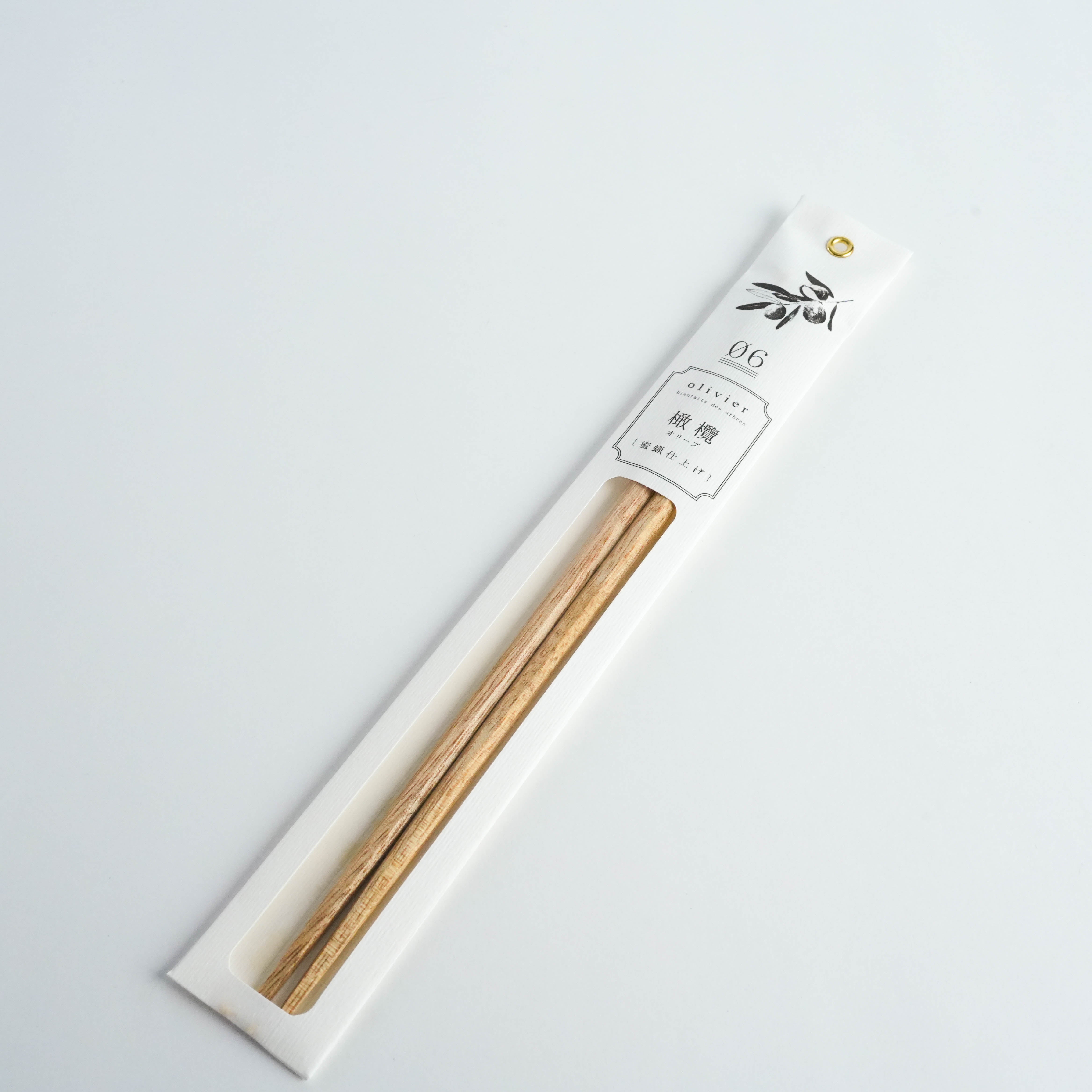 Kawai Tetoca Olive Chopsticks in retail packaging with natural finish and octagonal grip, ideal for elegant table settings.
