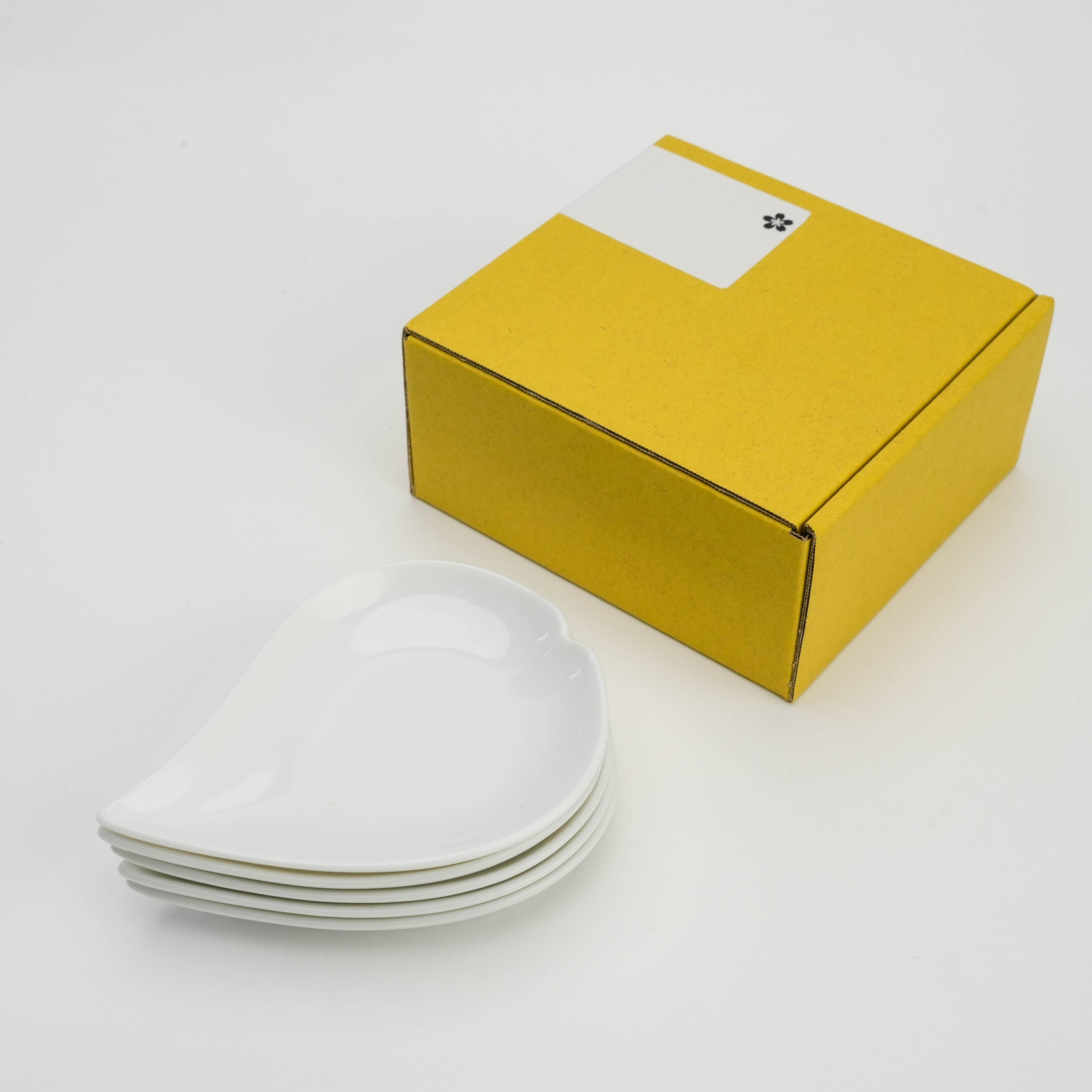 Mino Ware Sakura Petal Plate Set of 5 with yellow gift box, showcasing compact stackable design for stylish dining.
