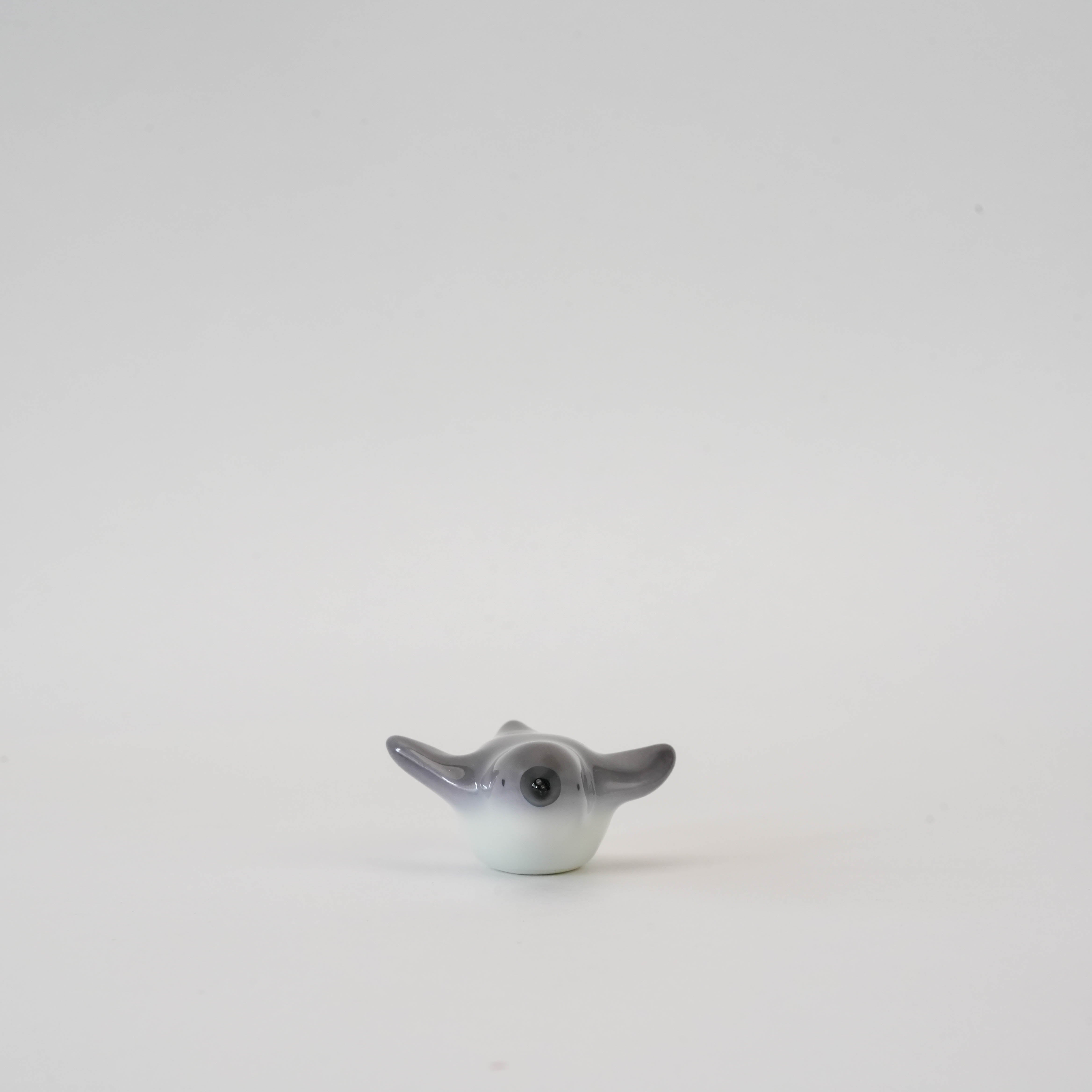 Front view of Penguin Chopstick Rest - Arita Ware, showcasing its smooth glaze and lifelike penguin design for stylish dining decor.